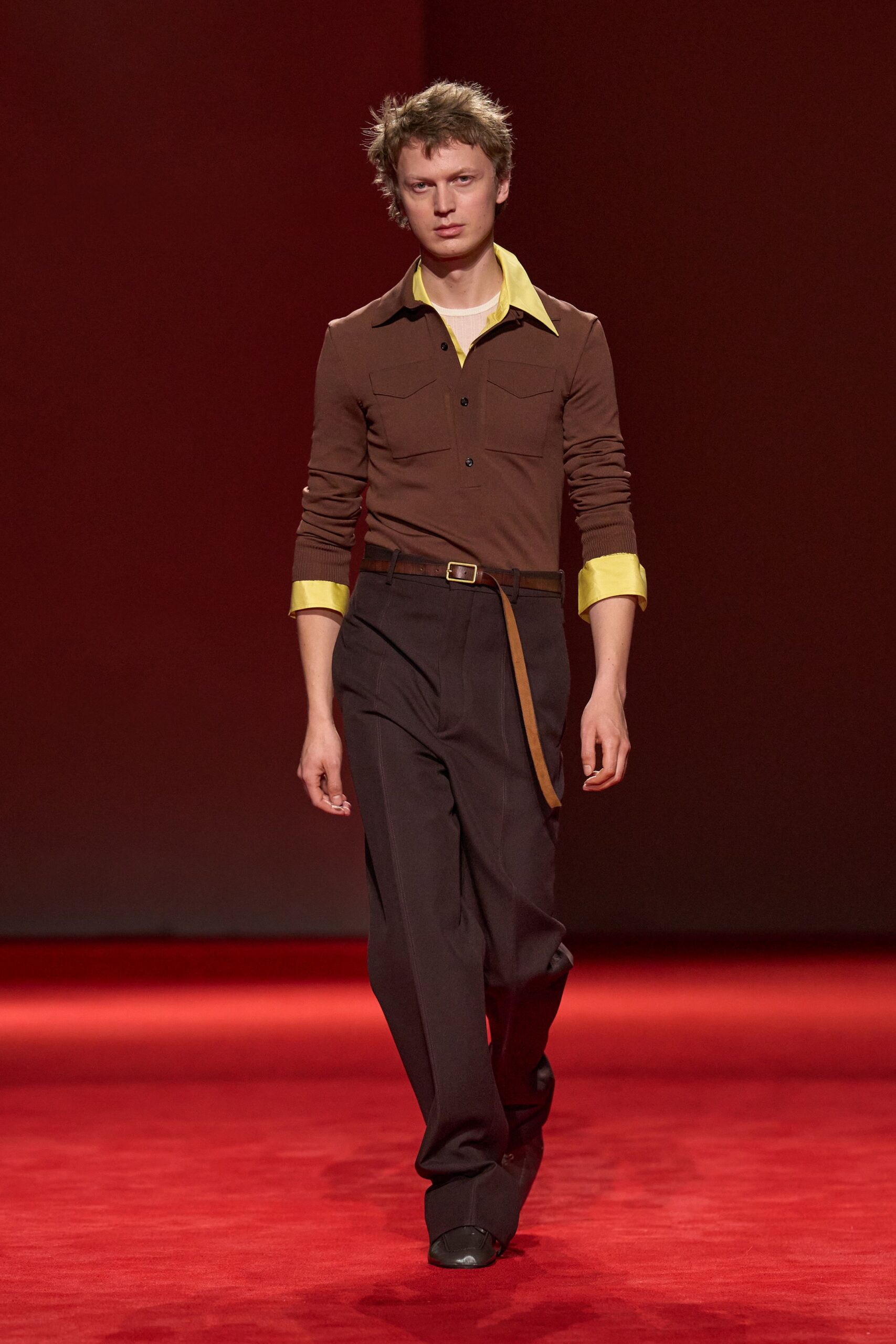 brown collared shirt and black pants