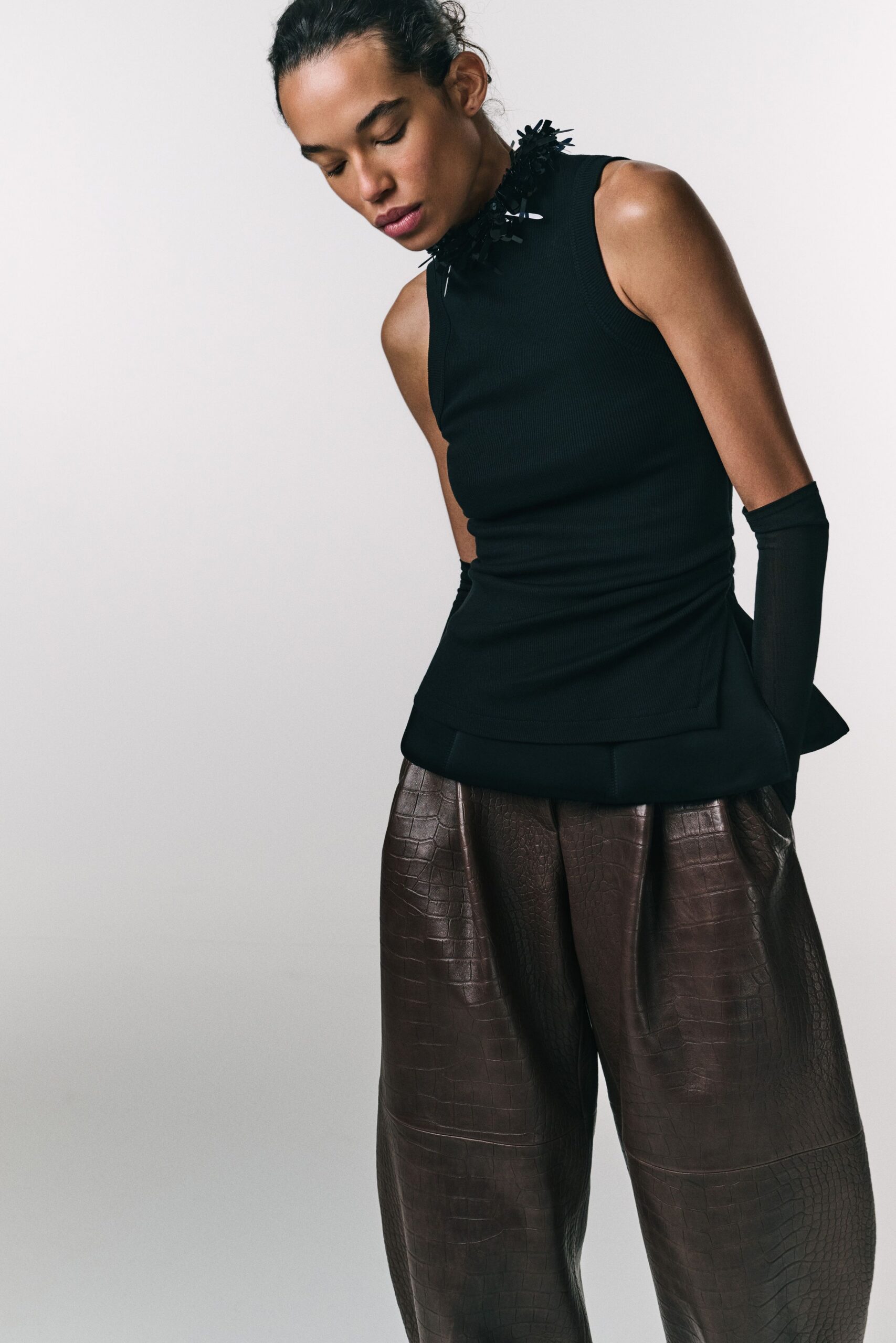 black cotton sleeveless high-neck fitted ruffled top