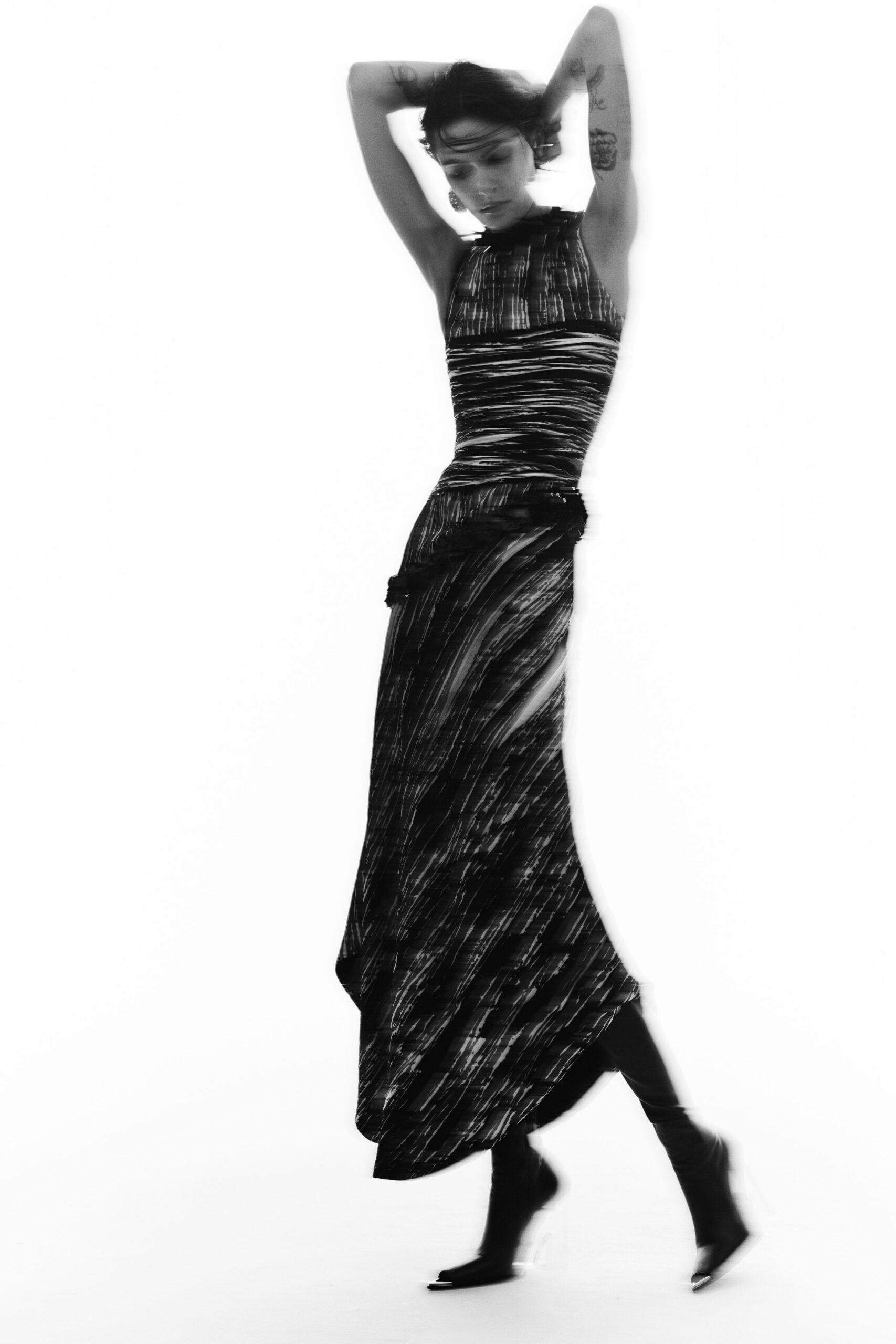 black silk sleeveless high-neck fitted ruched flowing gown