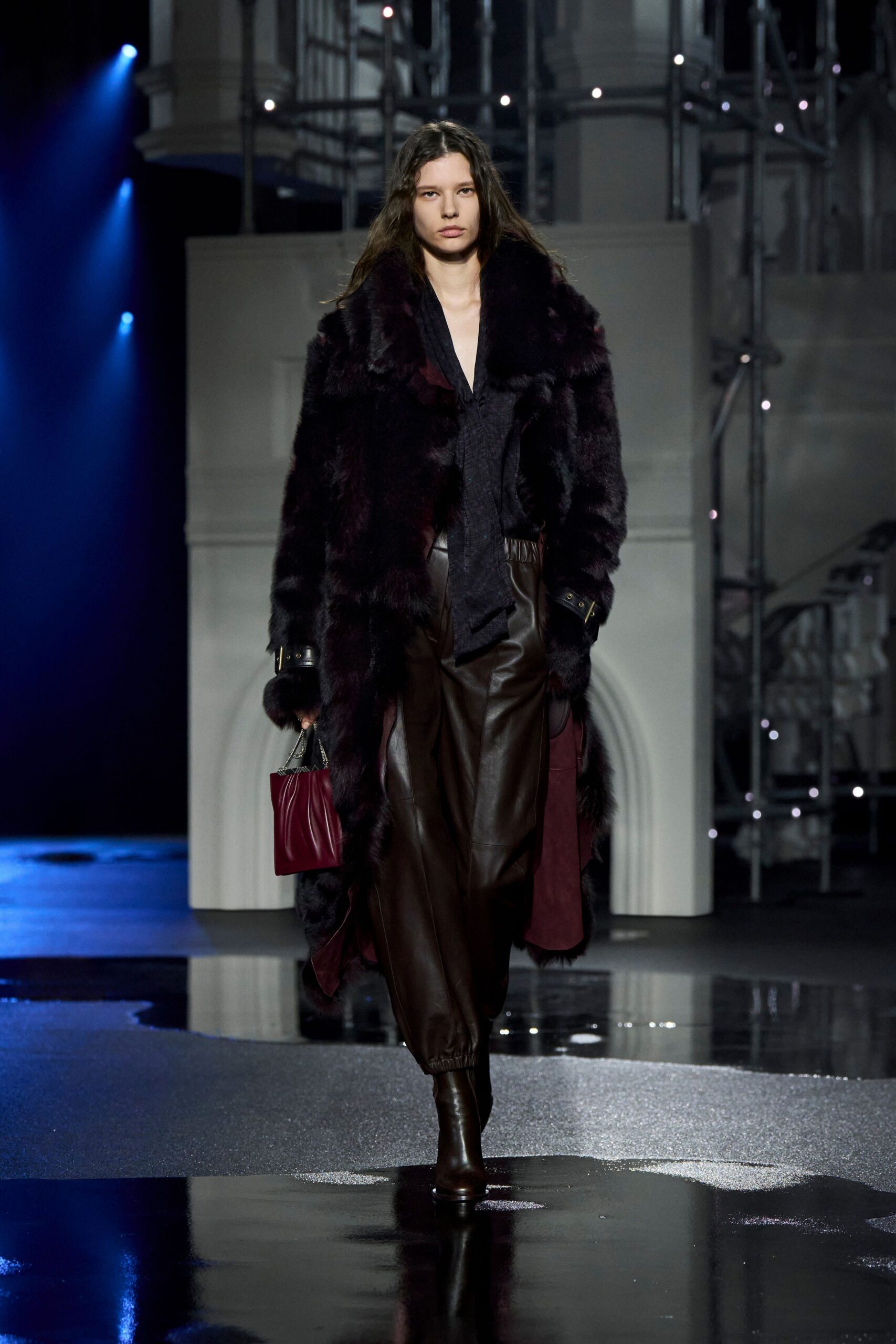 black fur coat with brown leather pants