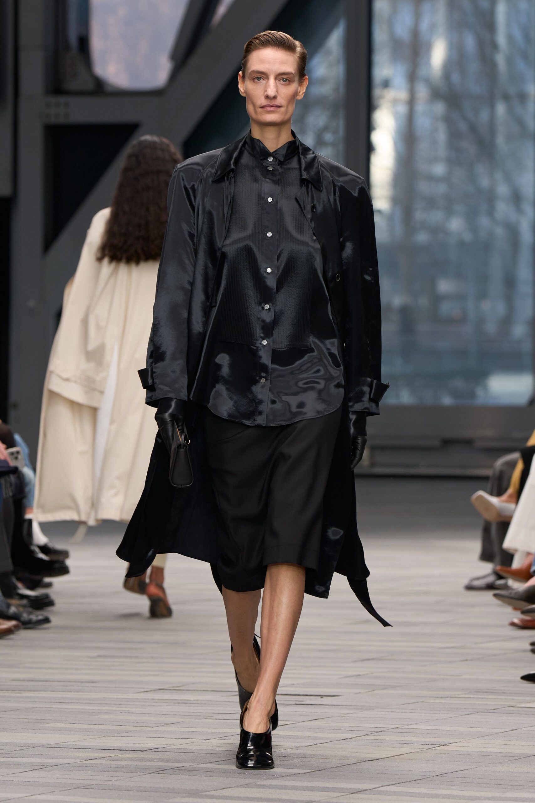 black silk long-sleeve collared relaxed buttoned flowing coat