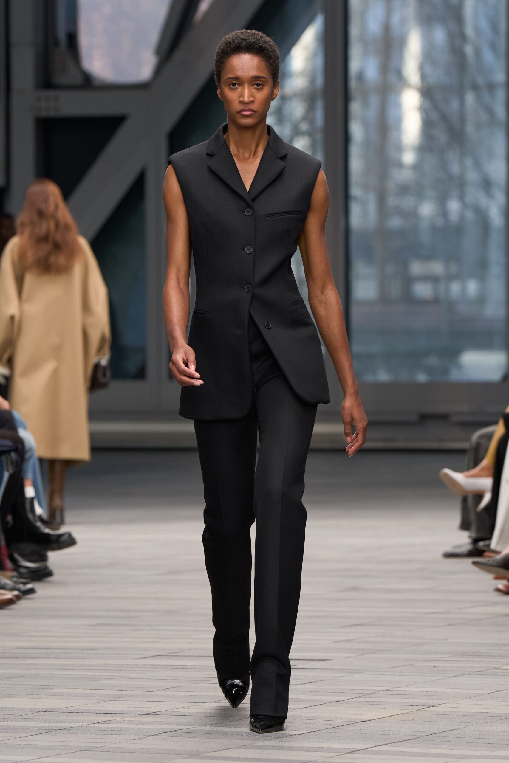 black wool sleeveless collared fitted buttoned suit