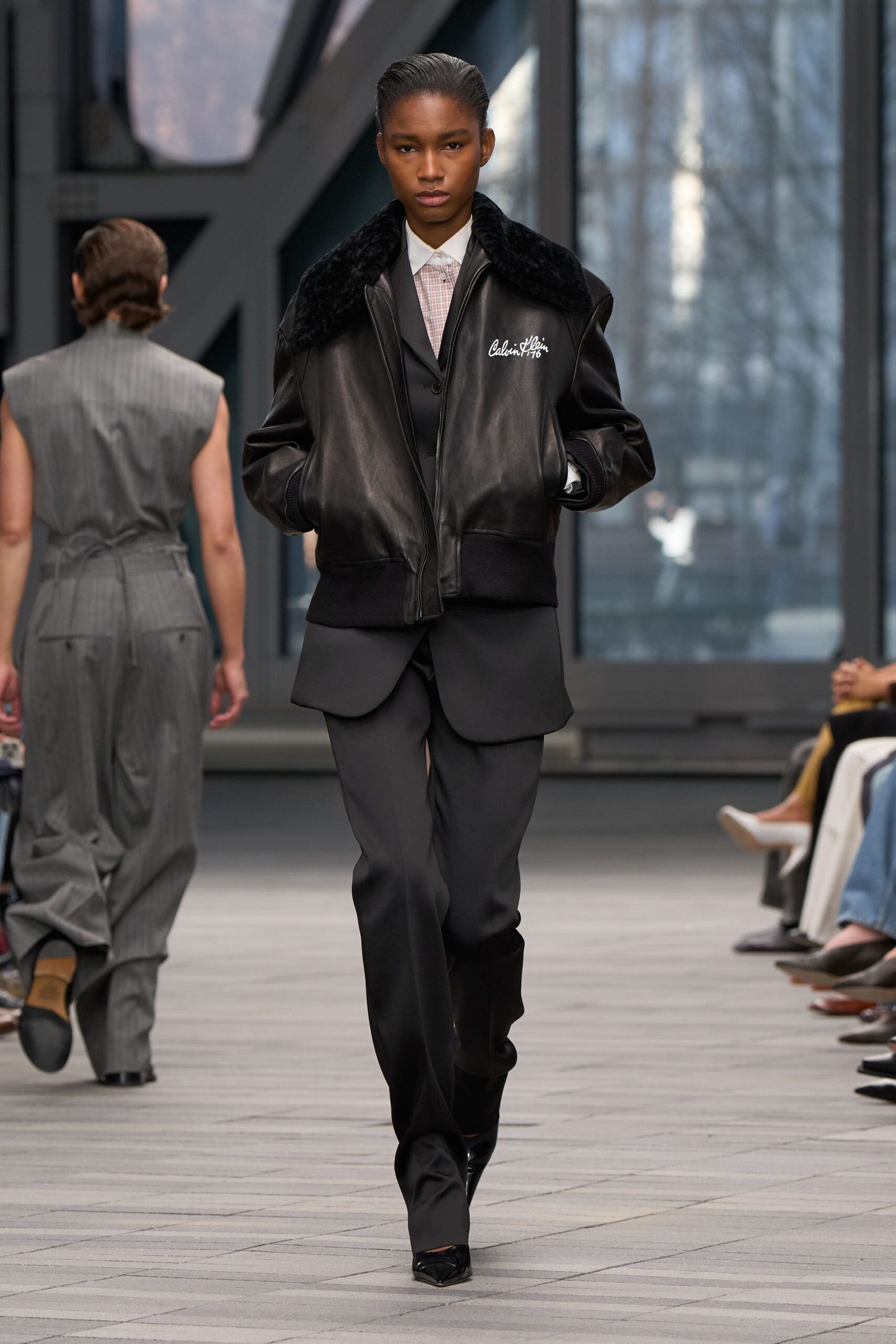 black leather jacket with tailored pants