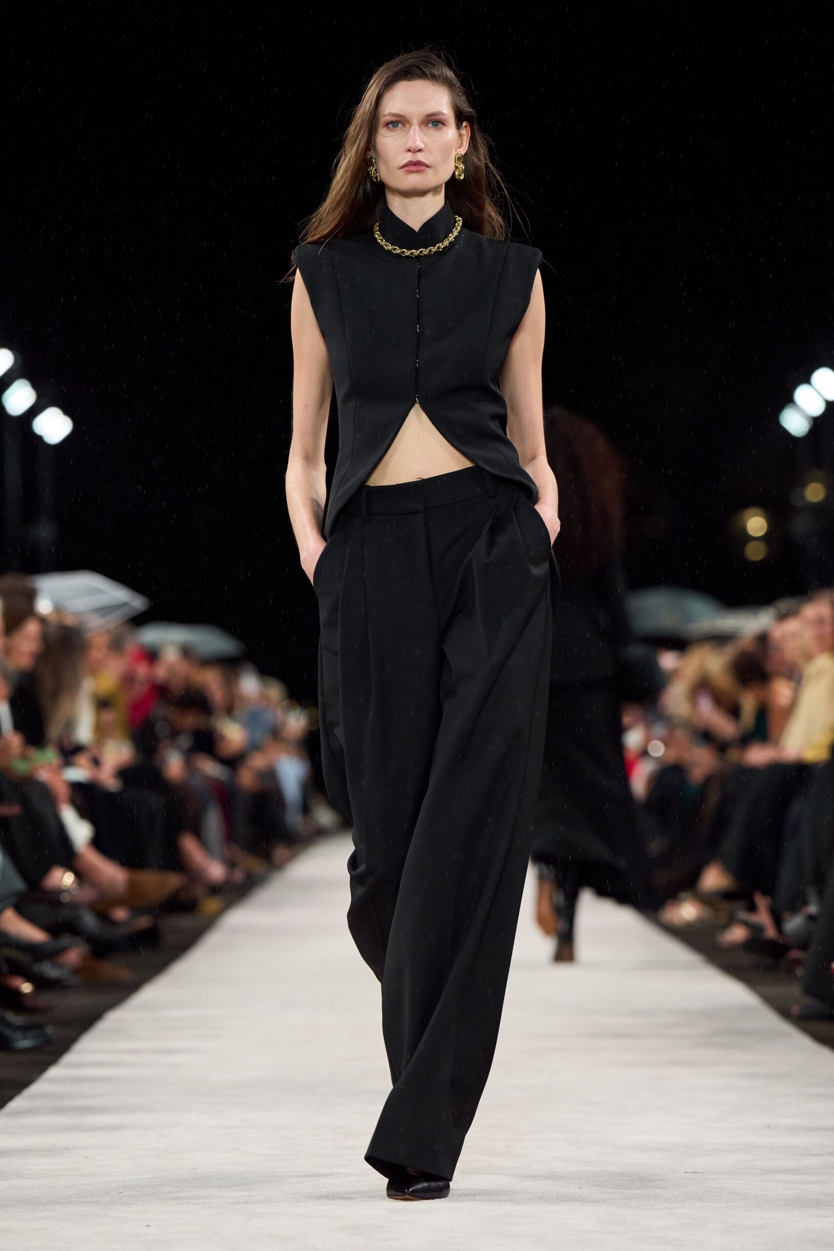 black sleeveless high-neck fitted top