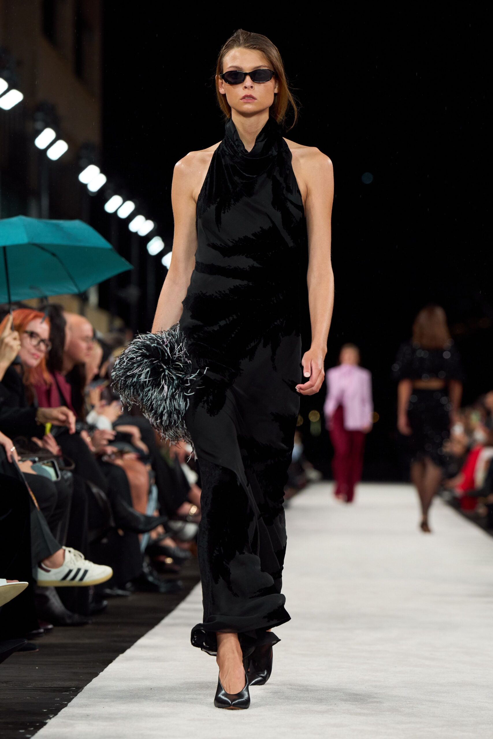 black velvet sleeveless high-neck fitted draped flowing gown