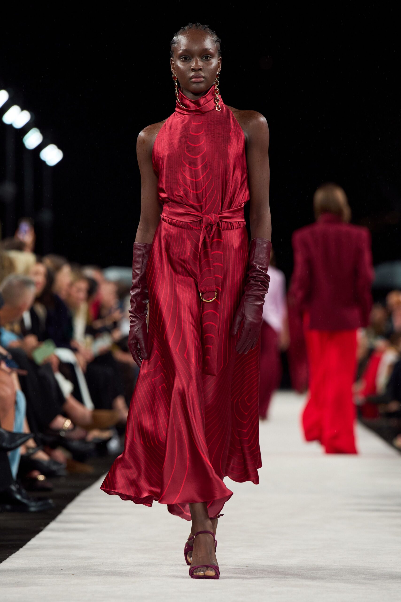 red silk sleeveless high-neck fitted pleated flowing dress