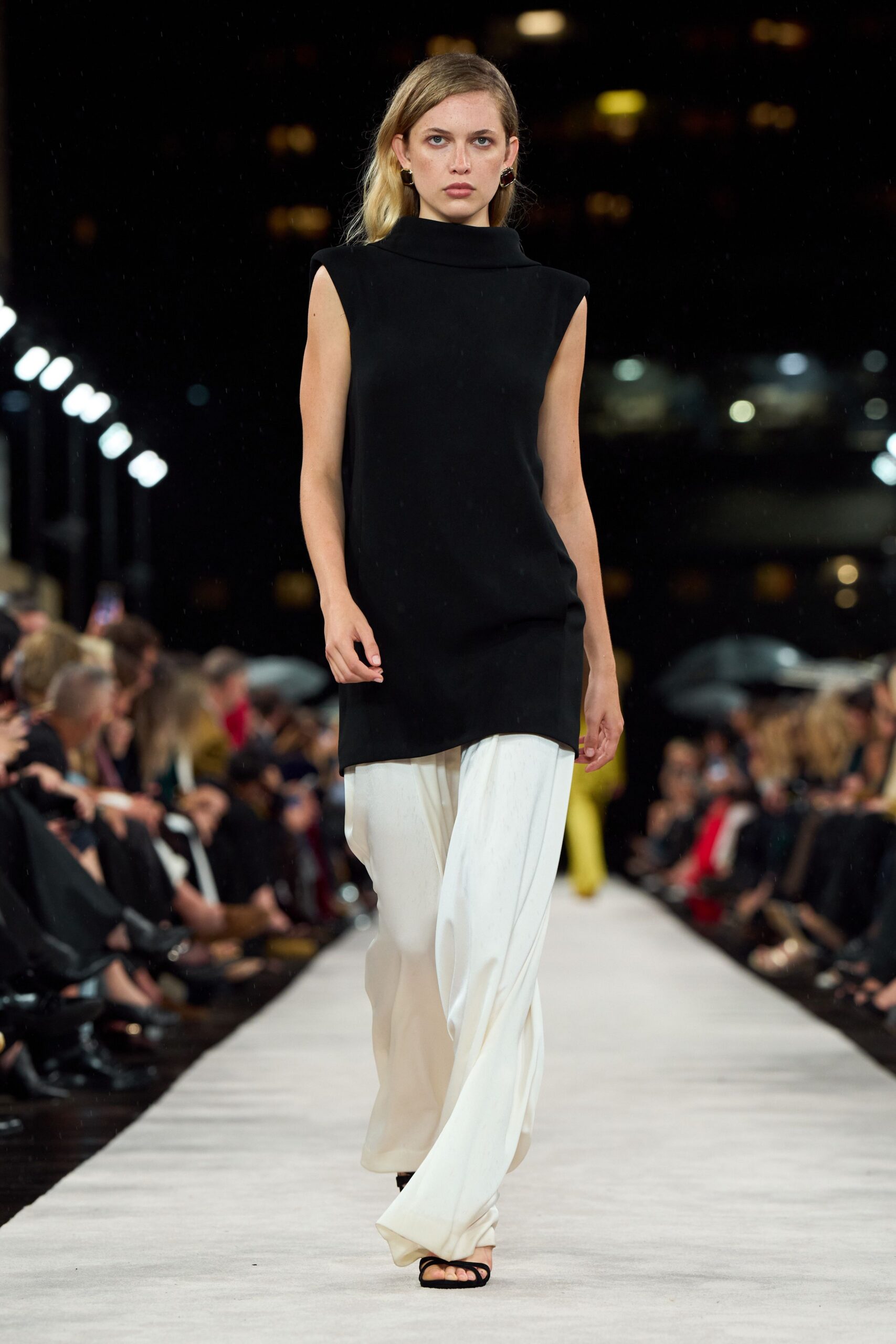 black sleeveless high-neck fitted top