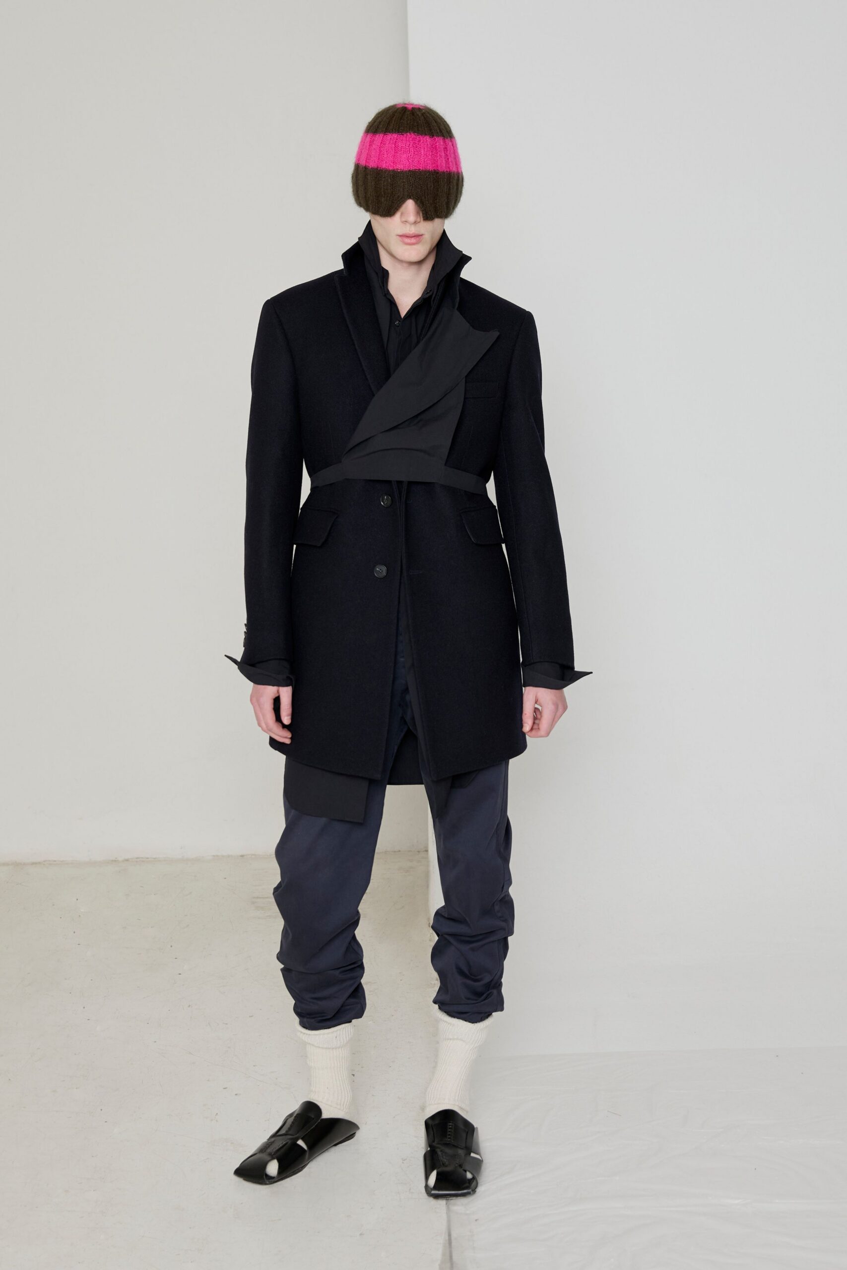 black wool long-sleeve collared structured buttoned coat