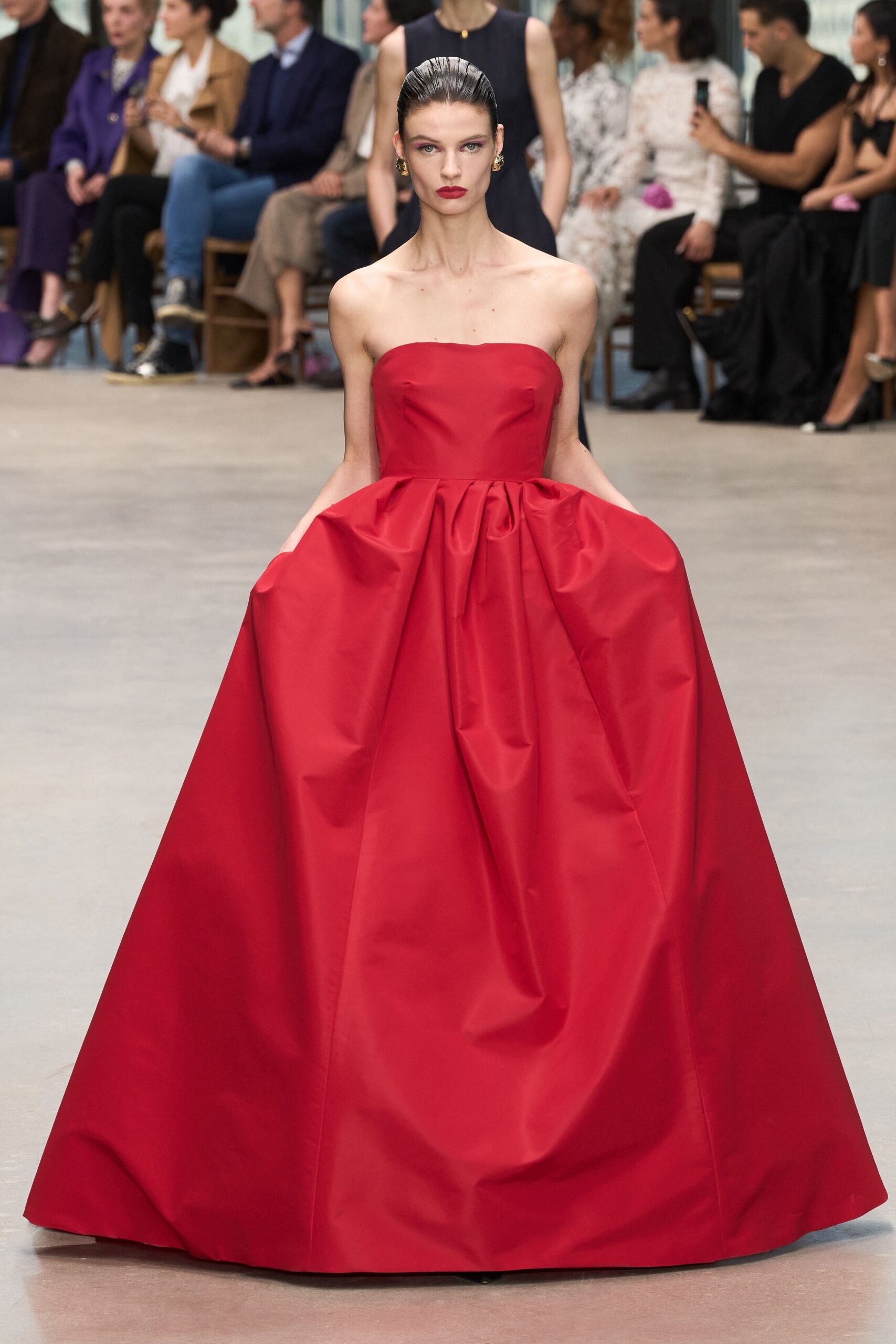 red strapless pleated gown
