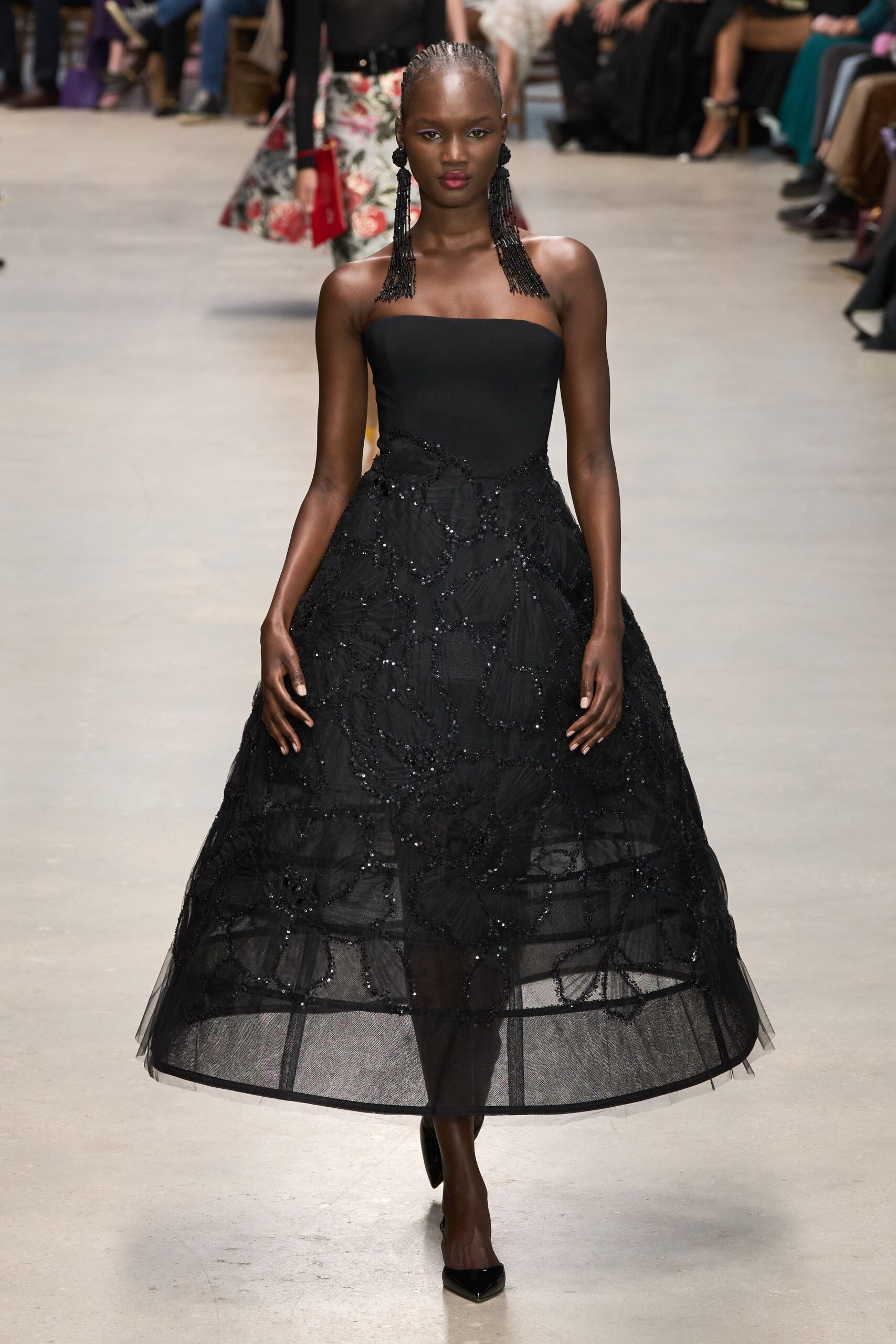black tulle strapless fitted embroidered tiered flowing gown