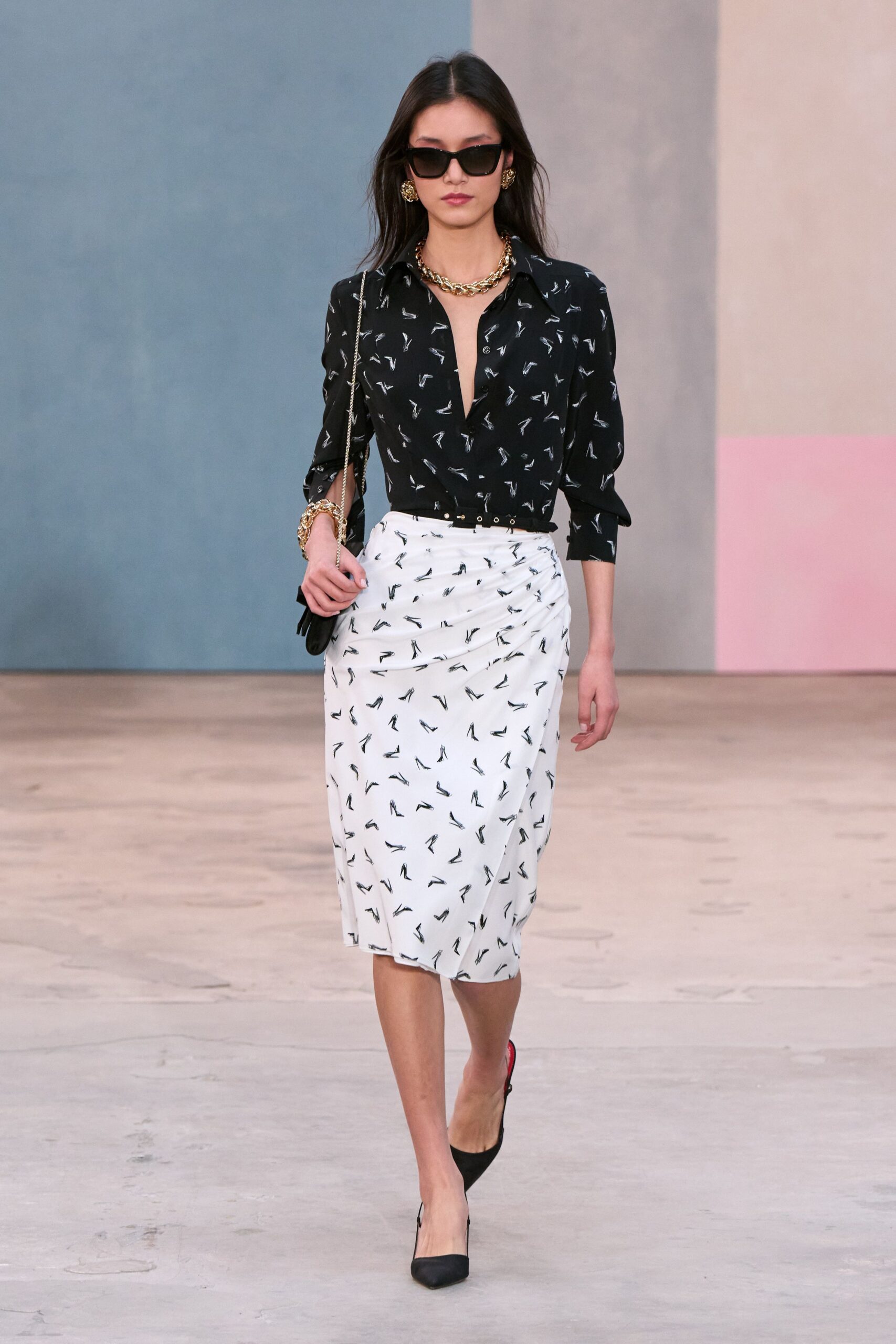 black fitted shirt and white ruched skirt