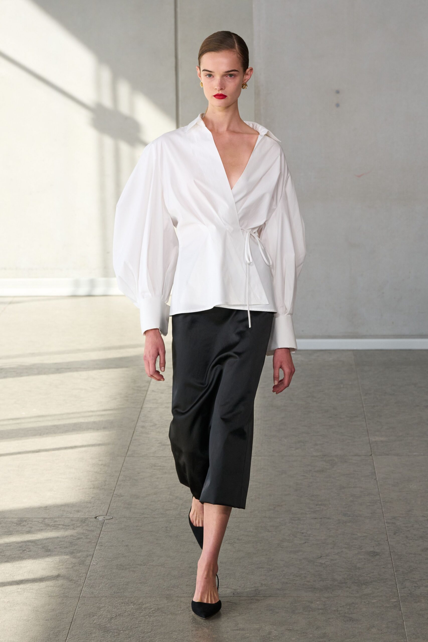 white relaxed top with black pants
