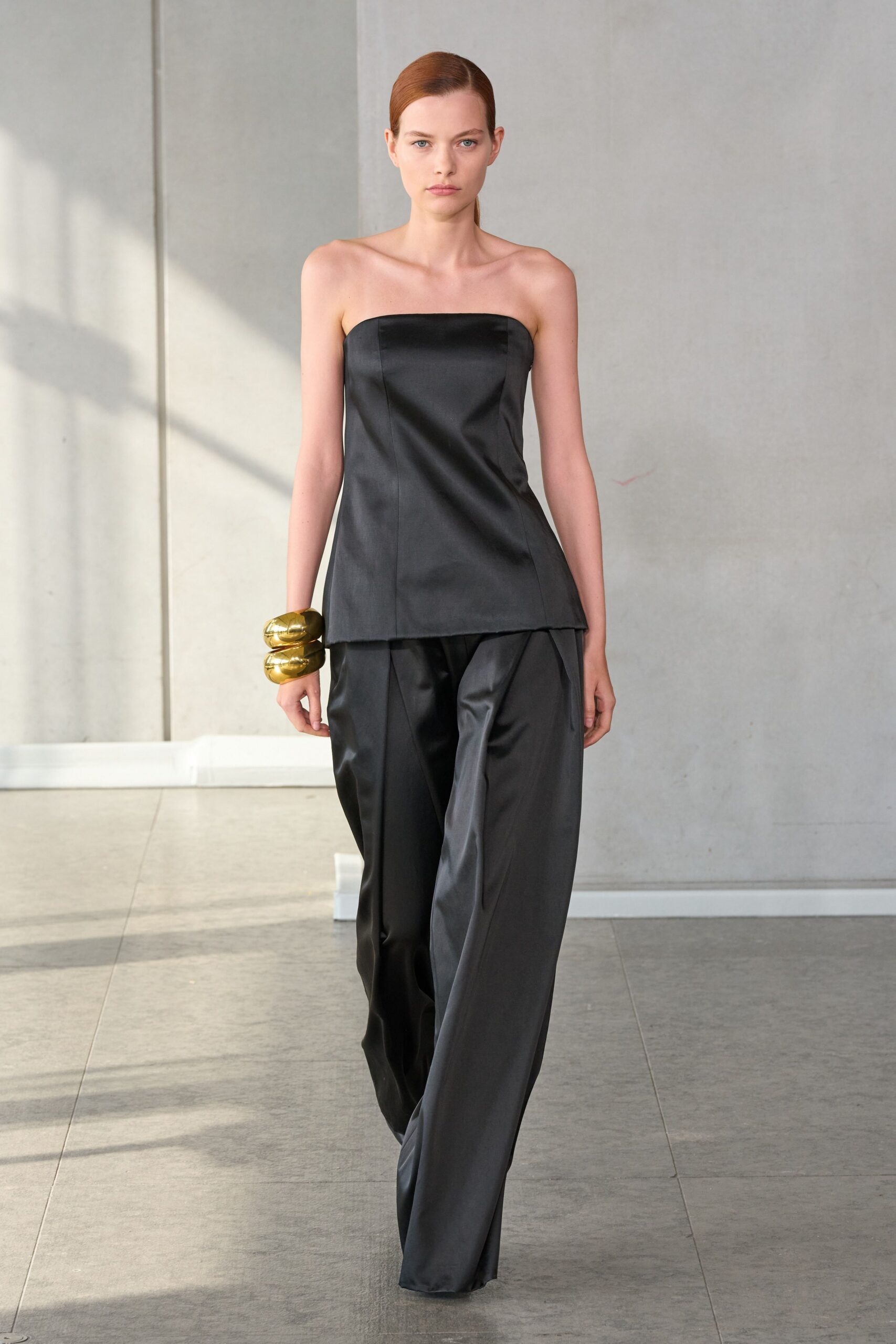 black silk fitted top and relaxed pants