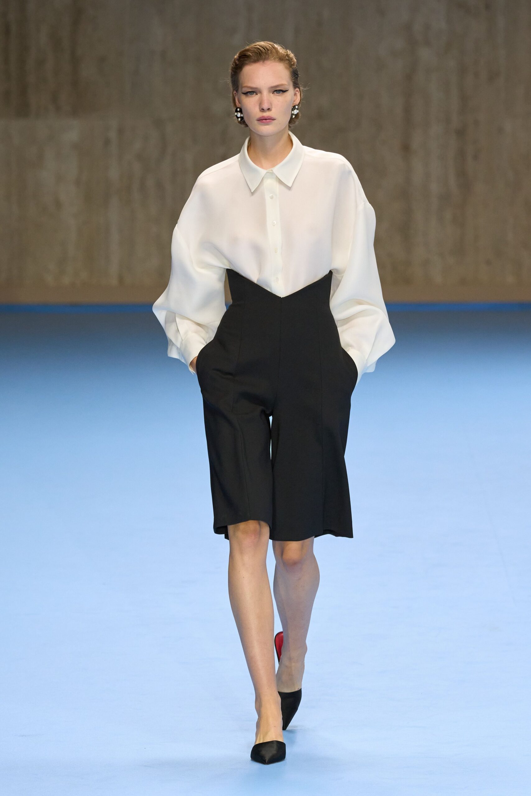 white relaxed shirt with black shorts