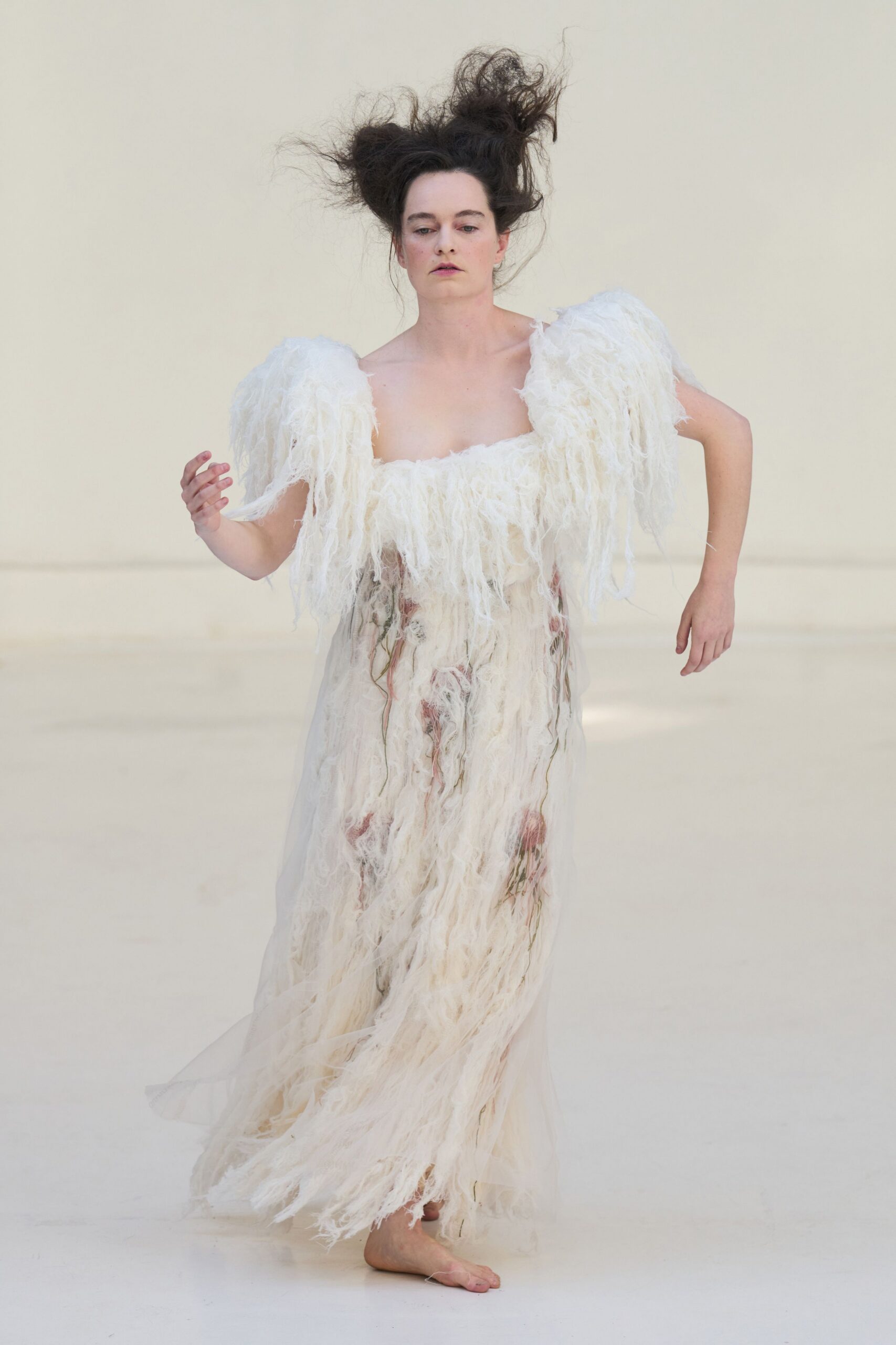 white flowing sleeveless gown