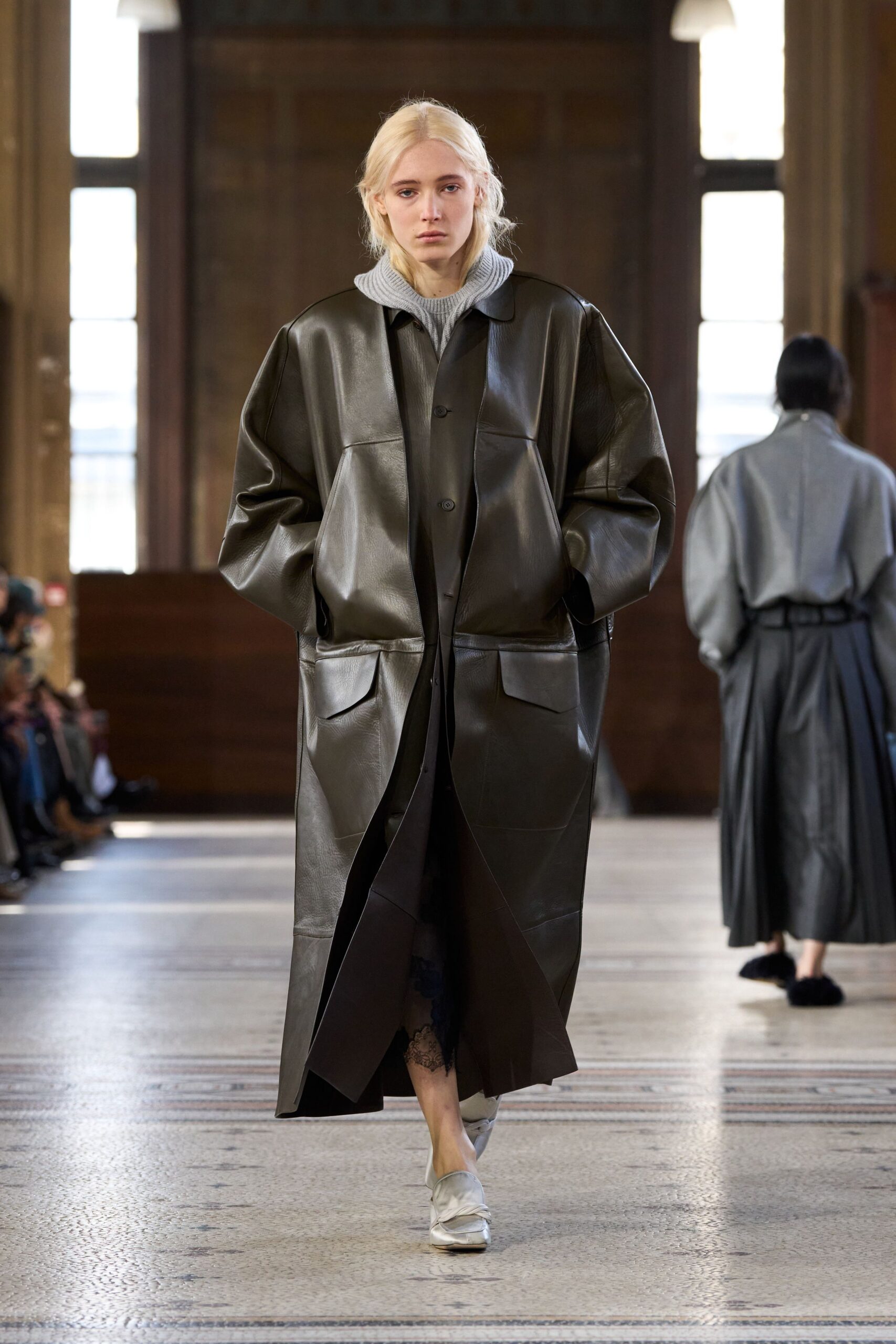 black leather long-sleeve collared oversized pockets coat