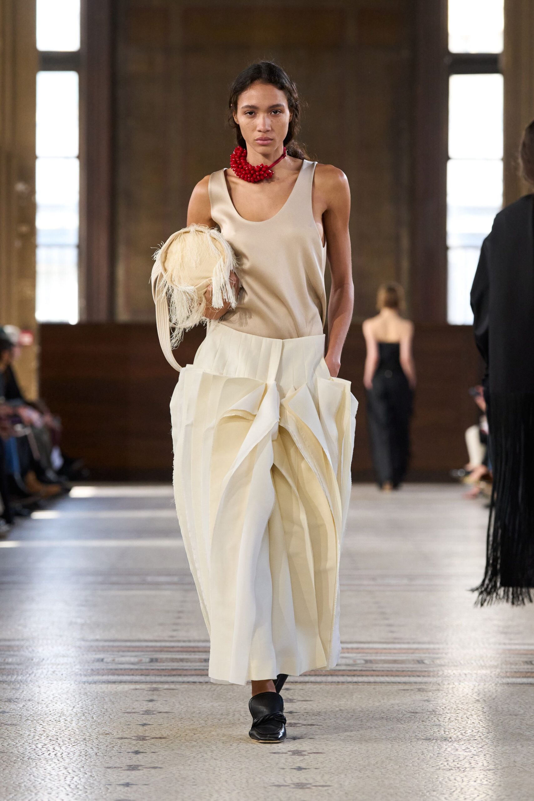 beige fringed bag