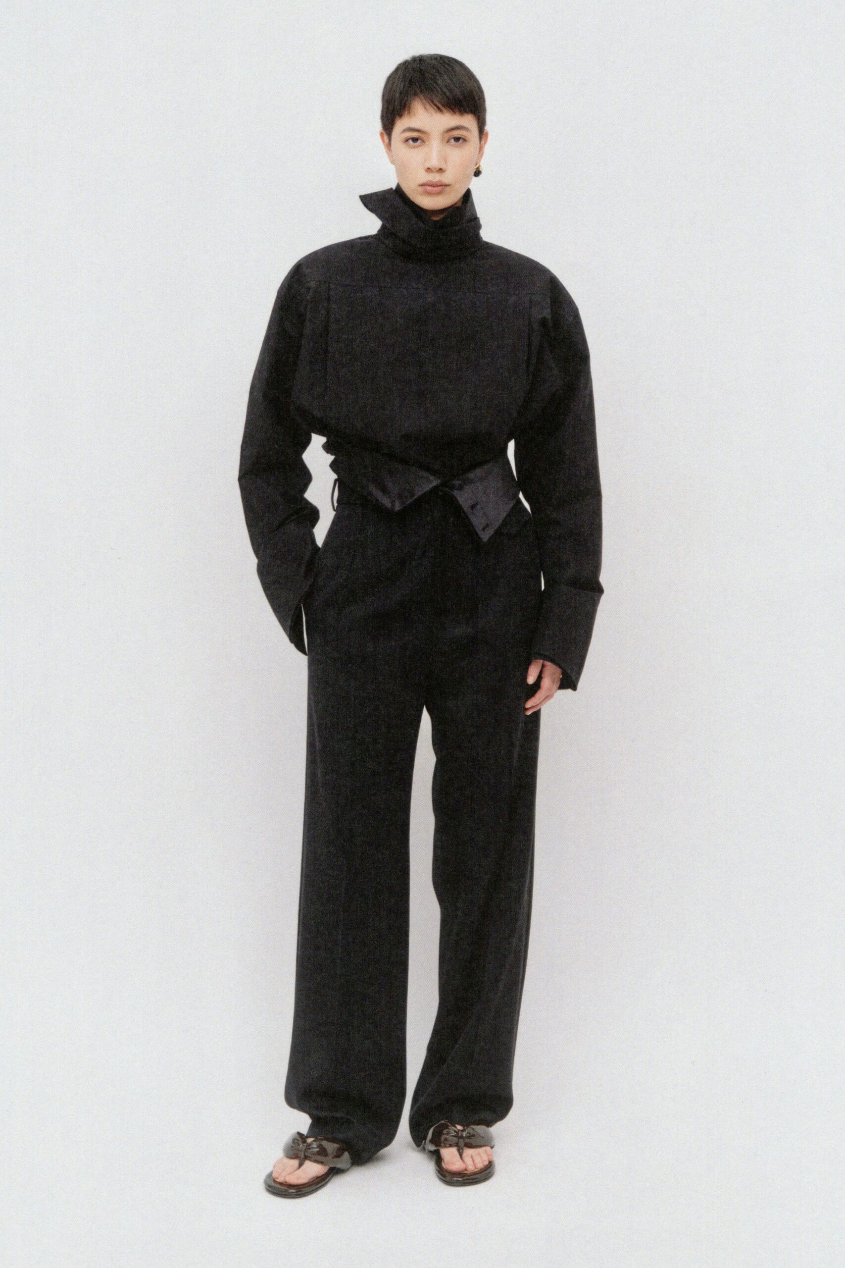 black denim long-sleeve high-neck relaxed belted wide-leg jumpsuit