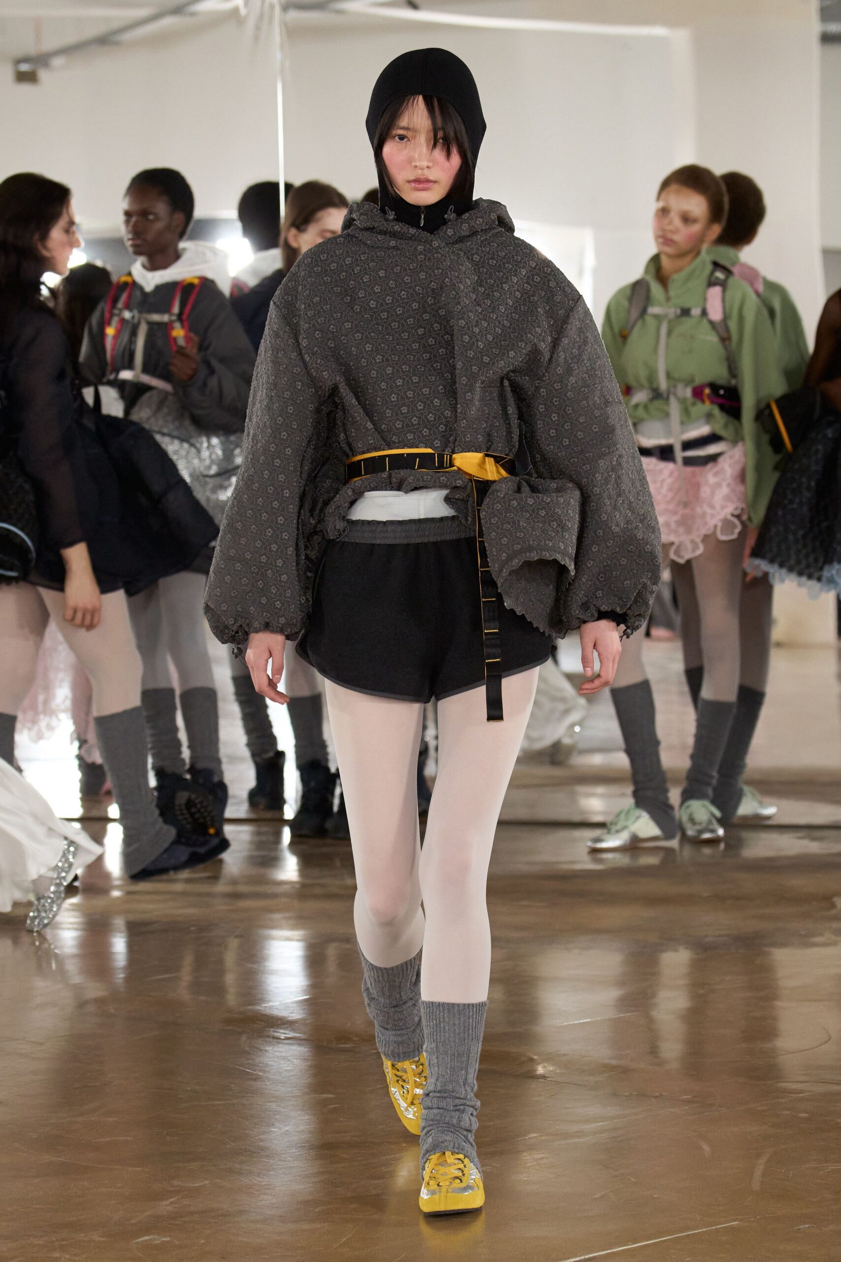 gray oversized hoodie with black shorts