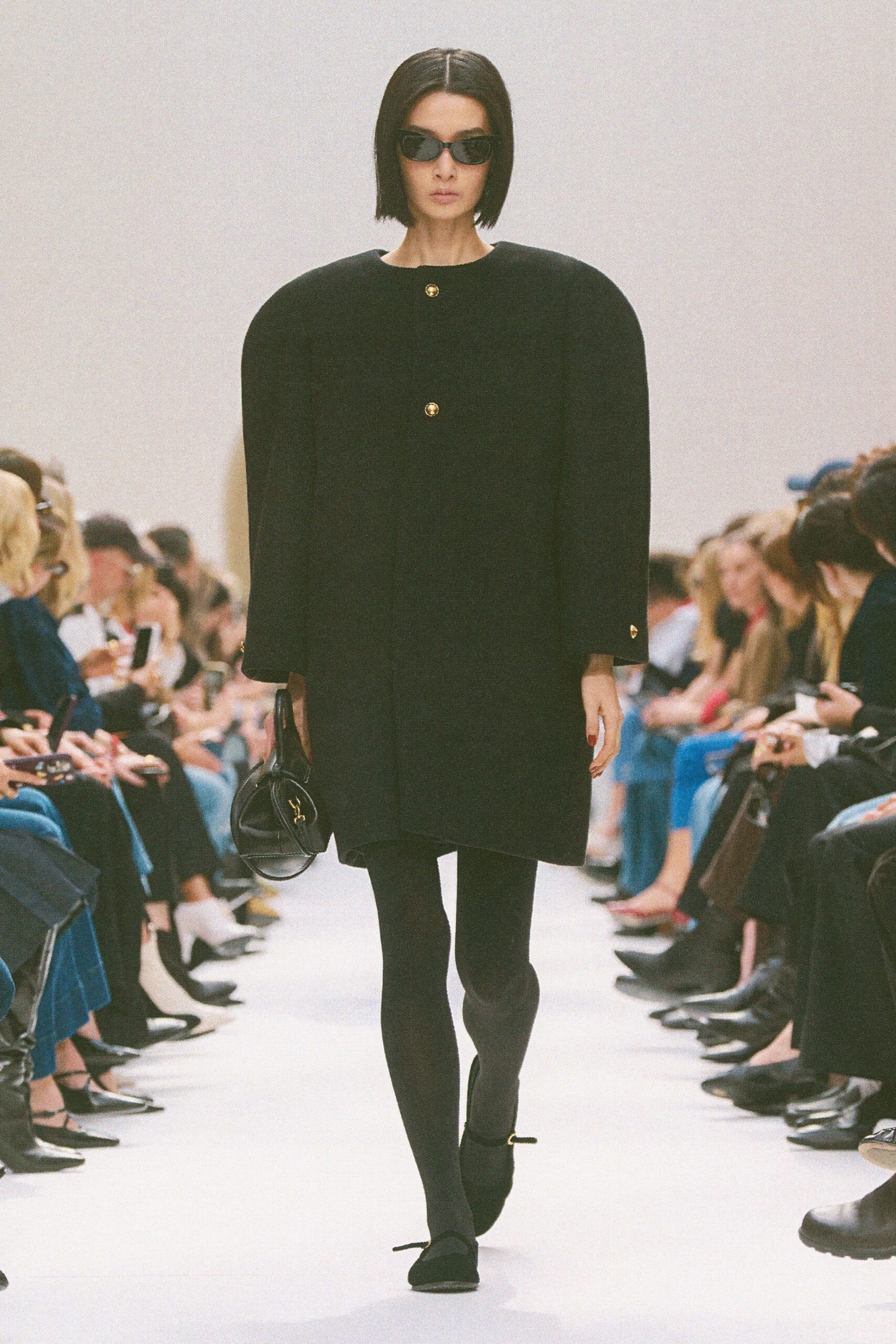 black wool long-sleeve collared structured buttoned coat