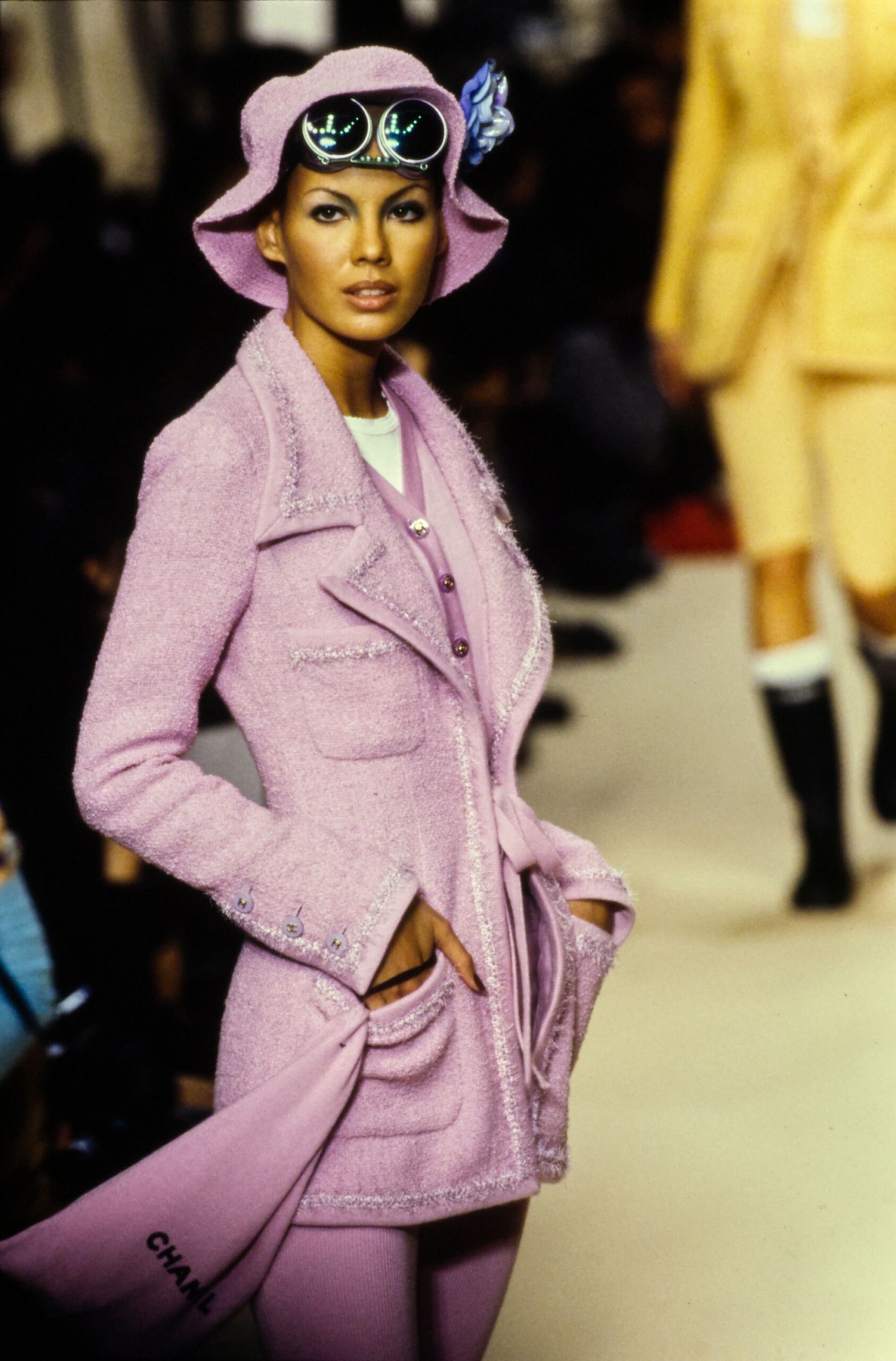 pink tweed coat with sunglasses