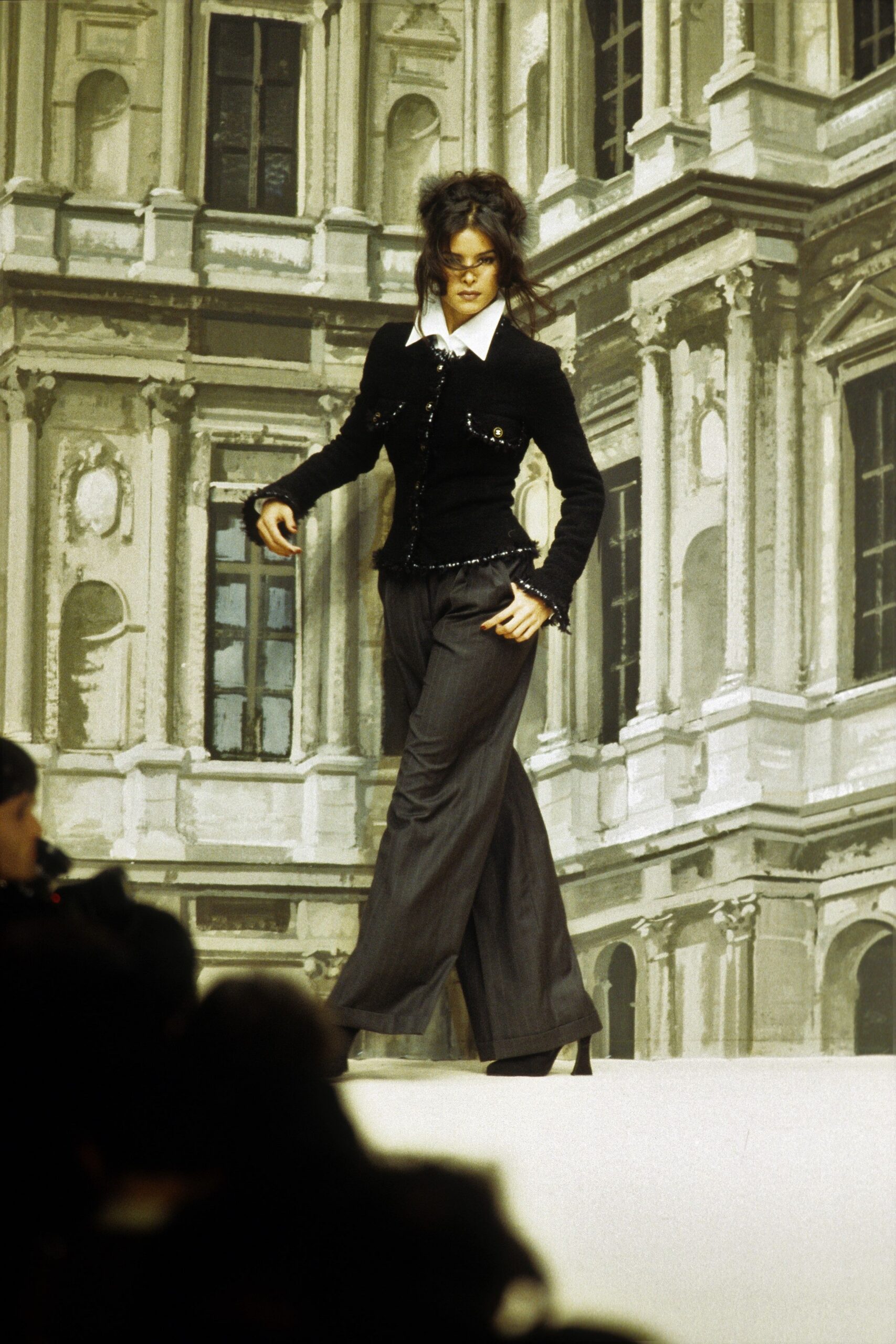 black velvet fitted blazer with gray pants