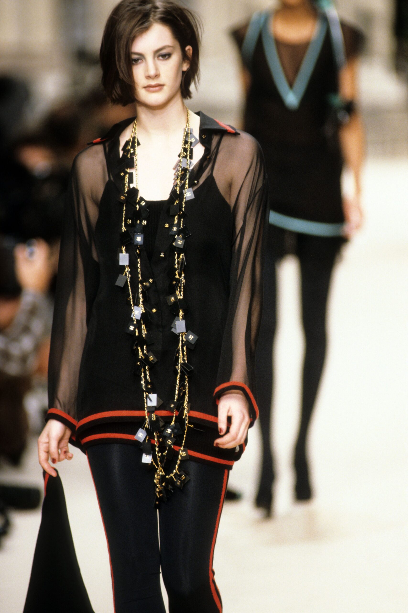 black sheer top with fitted pants