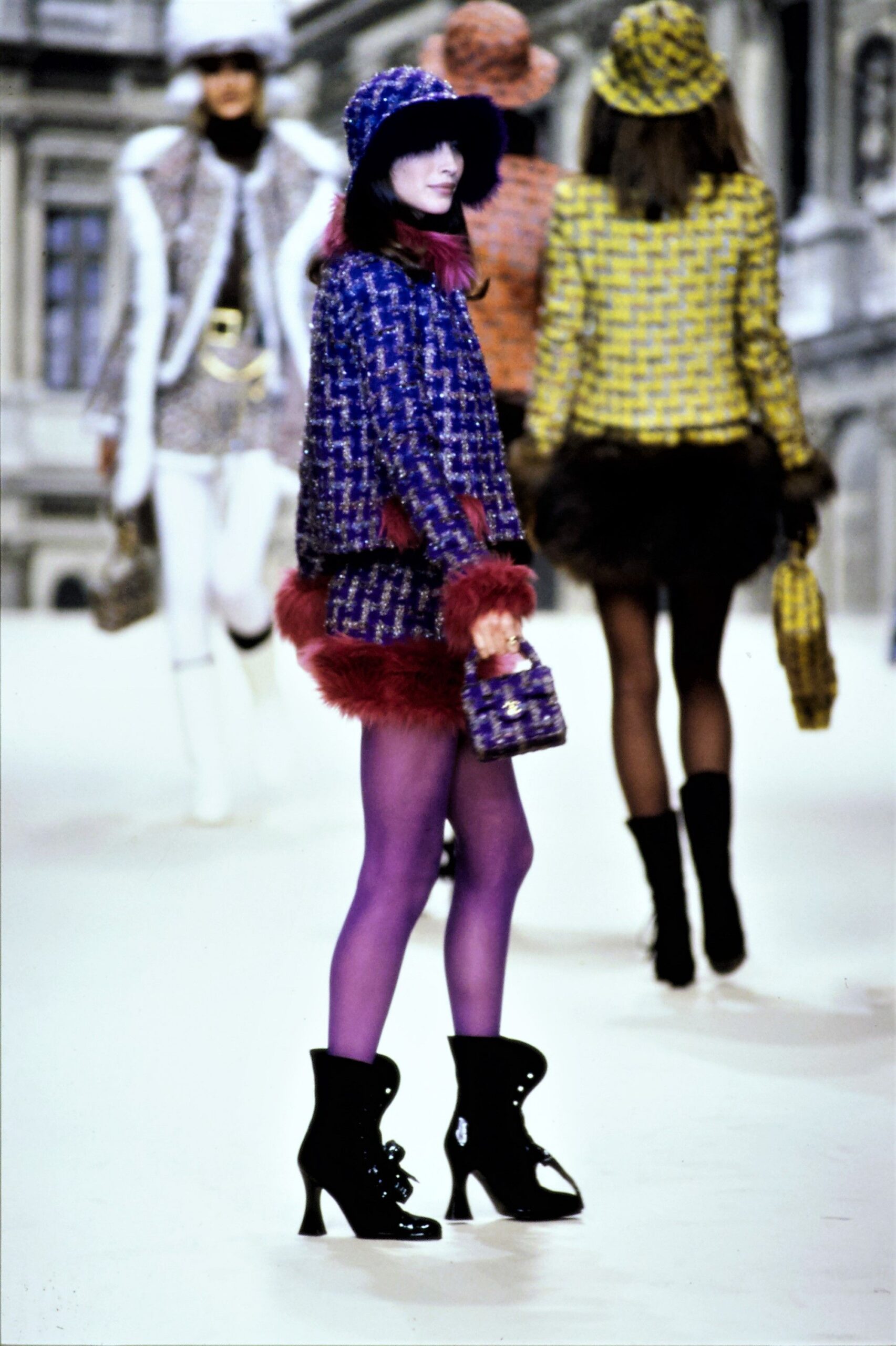 fitted blue tweed jacket with red skirt