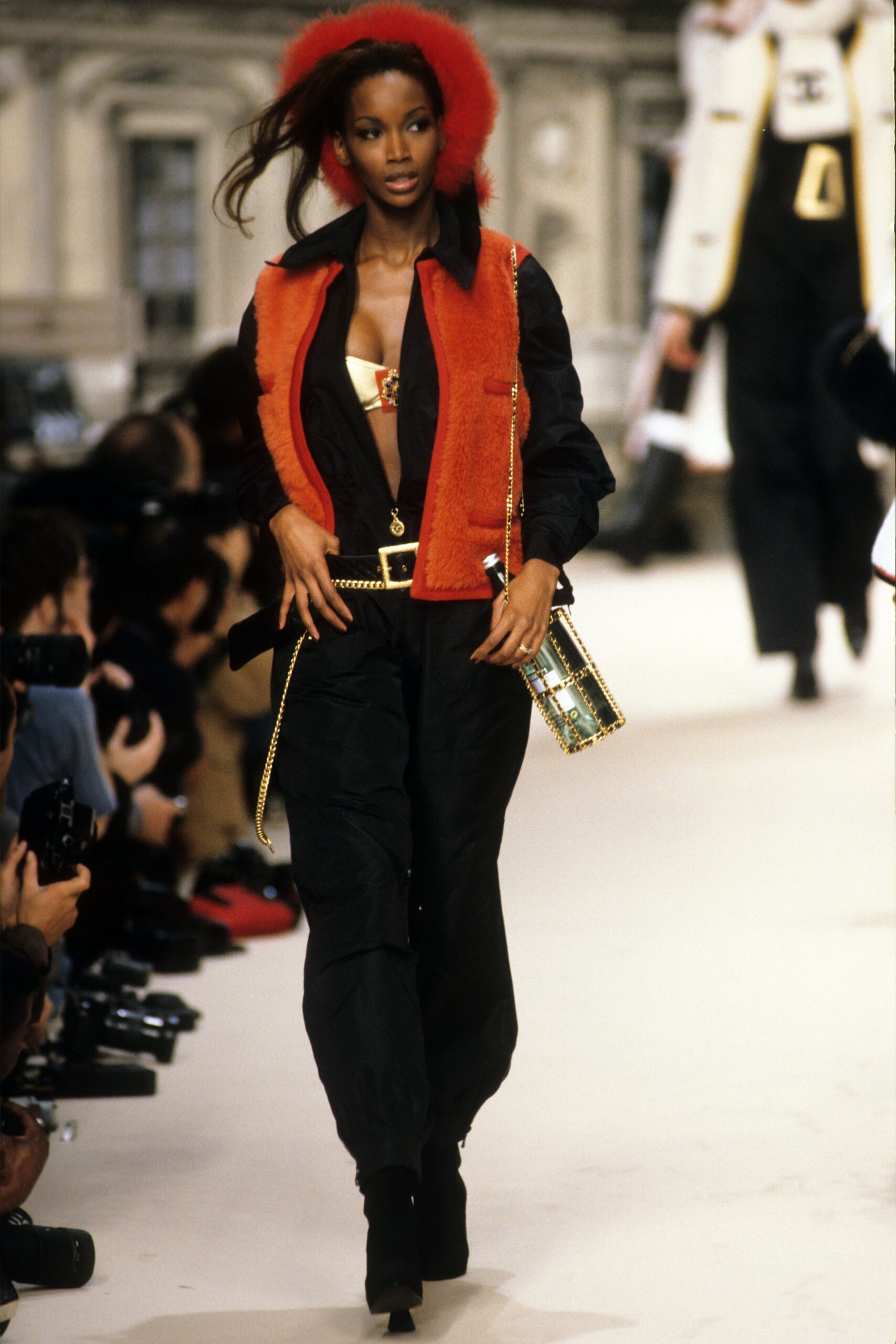 red faux-fur vest with black top