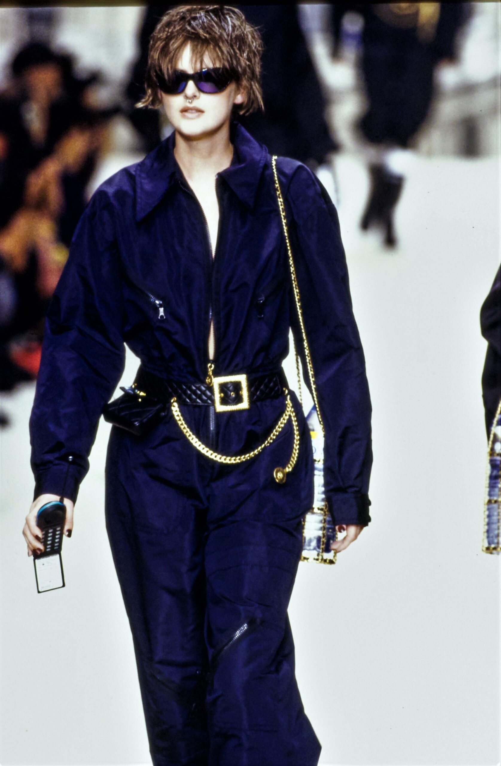 blue fitted jumpsuit with accessories