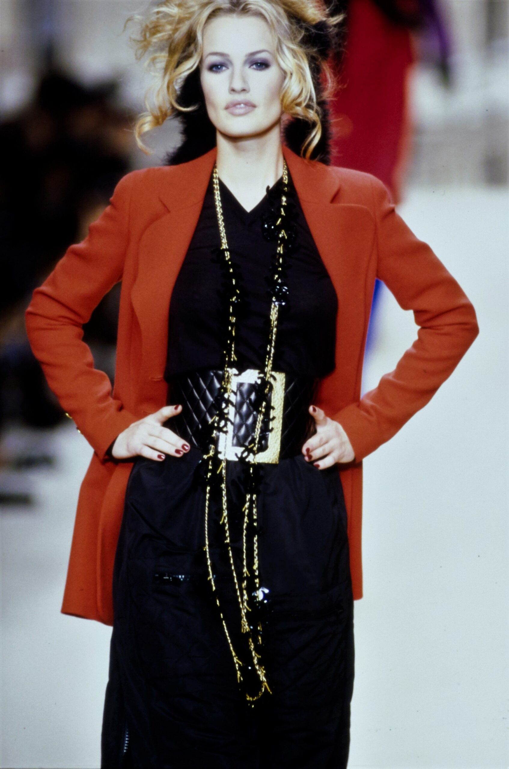 red tailored blazer with black top