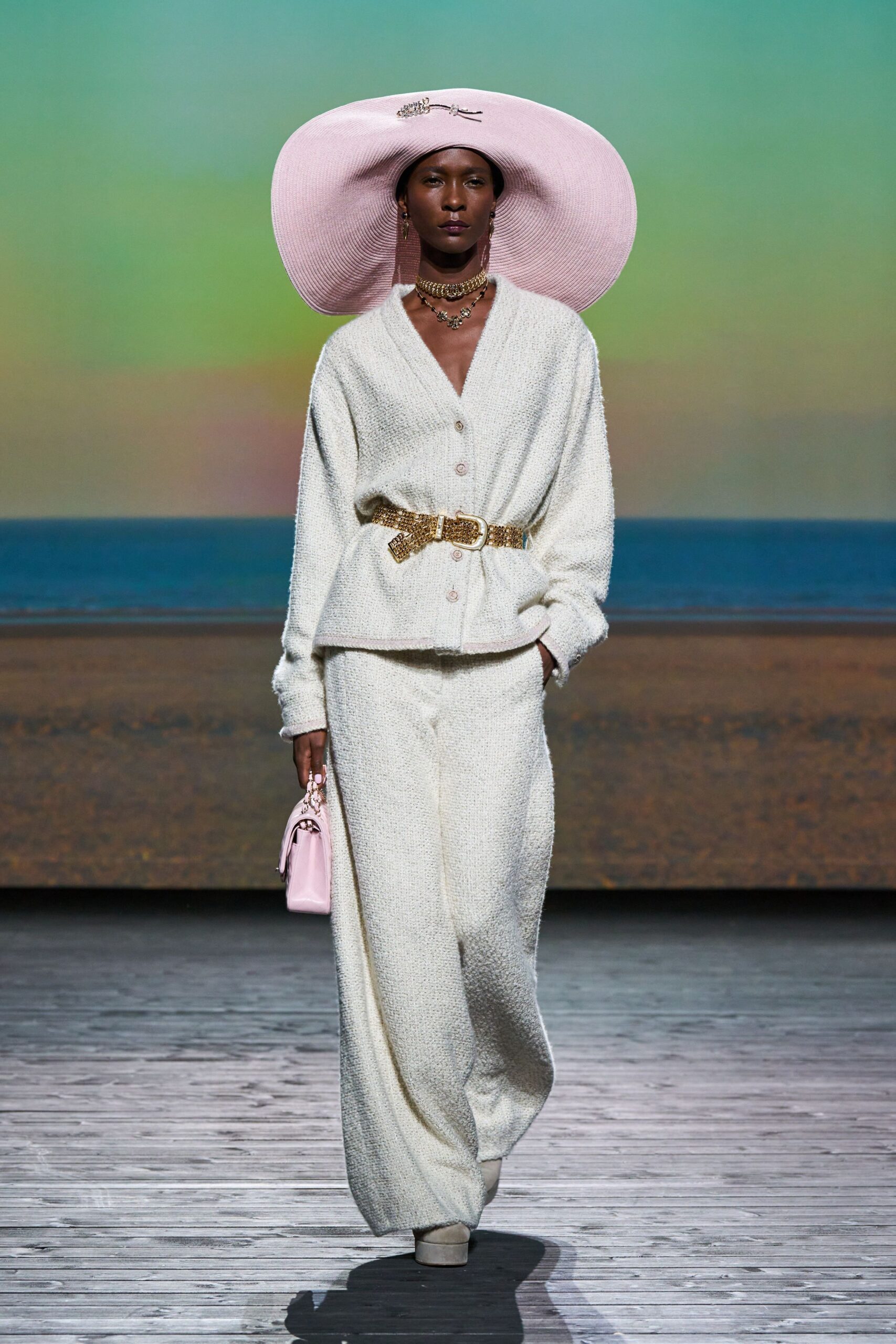 white cardigan and pants with pink hat