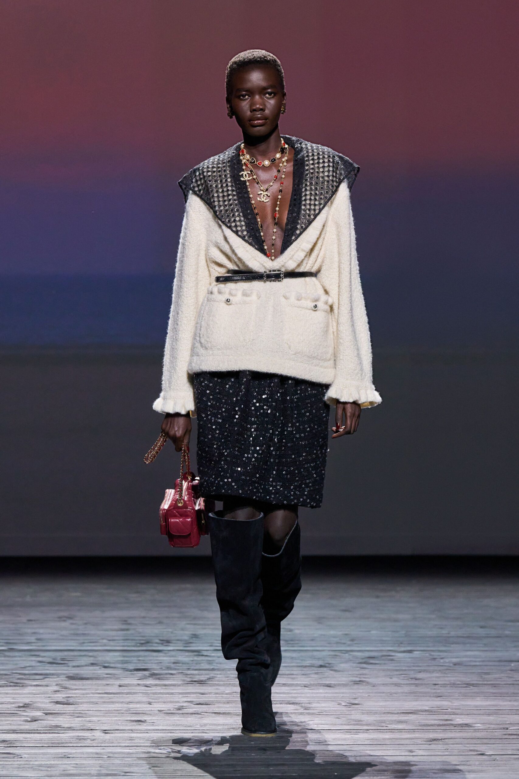 white faux-fur jacket with black sequin skirt