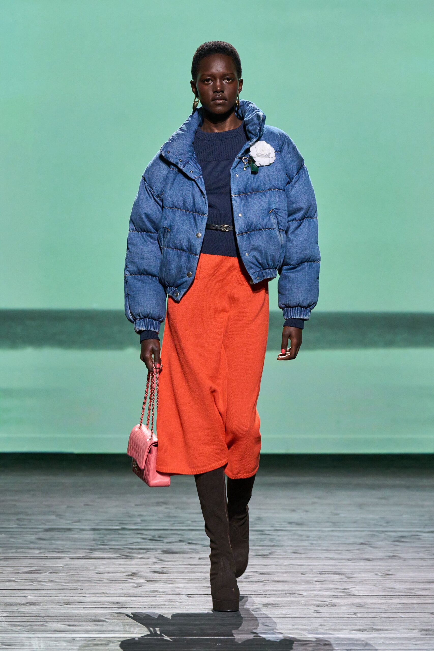 blue puffer jacket orange midi skirt