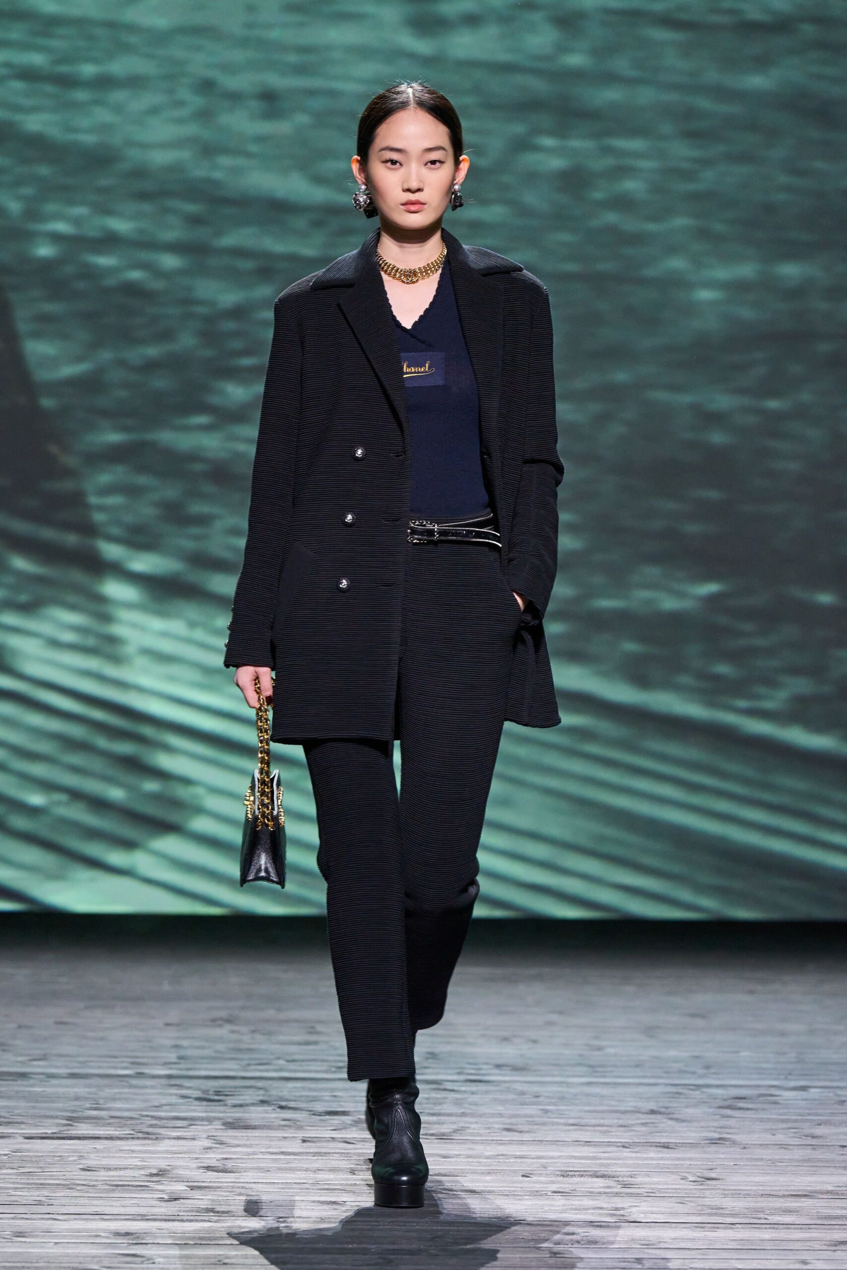black tailored coat with blue top