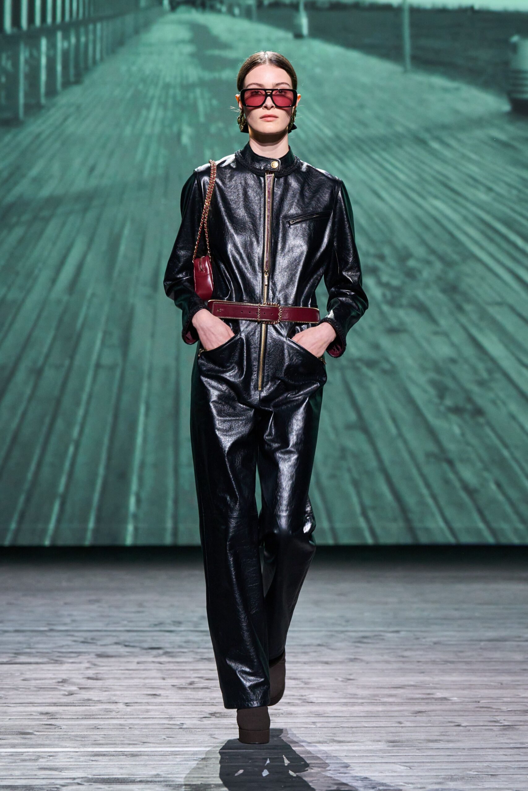 black leather long-sleeve collared fitted zippered pockets jumpsuit