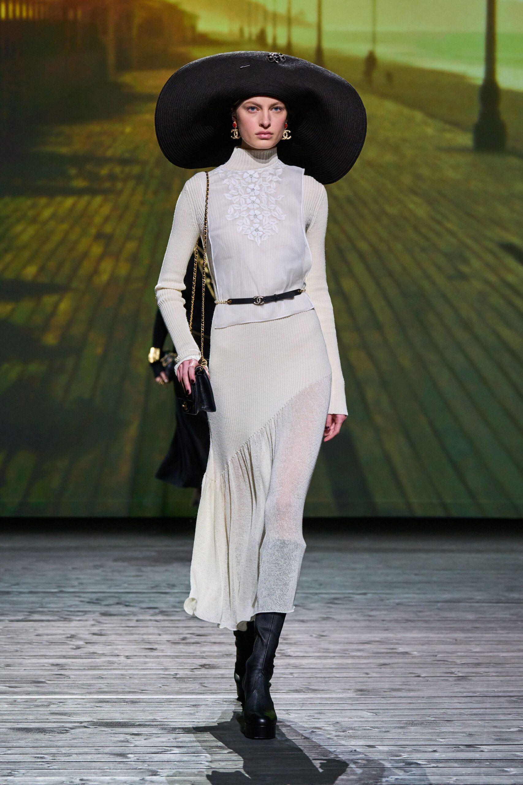 white fitted midi dress with black accessories