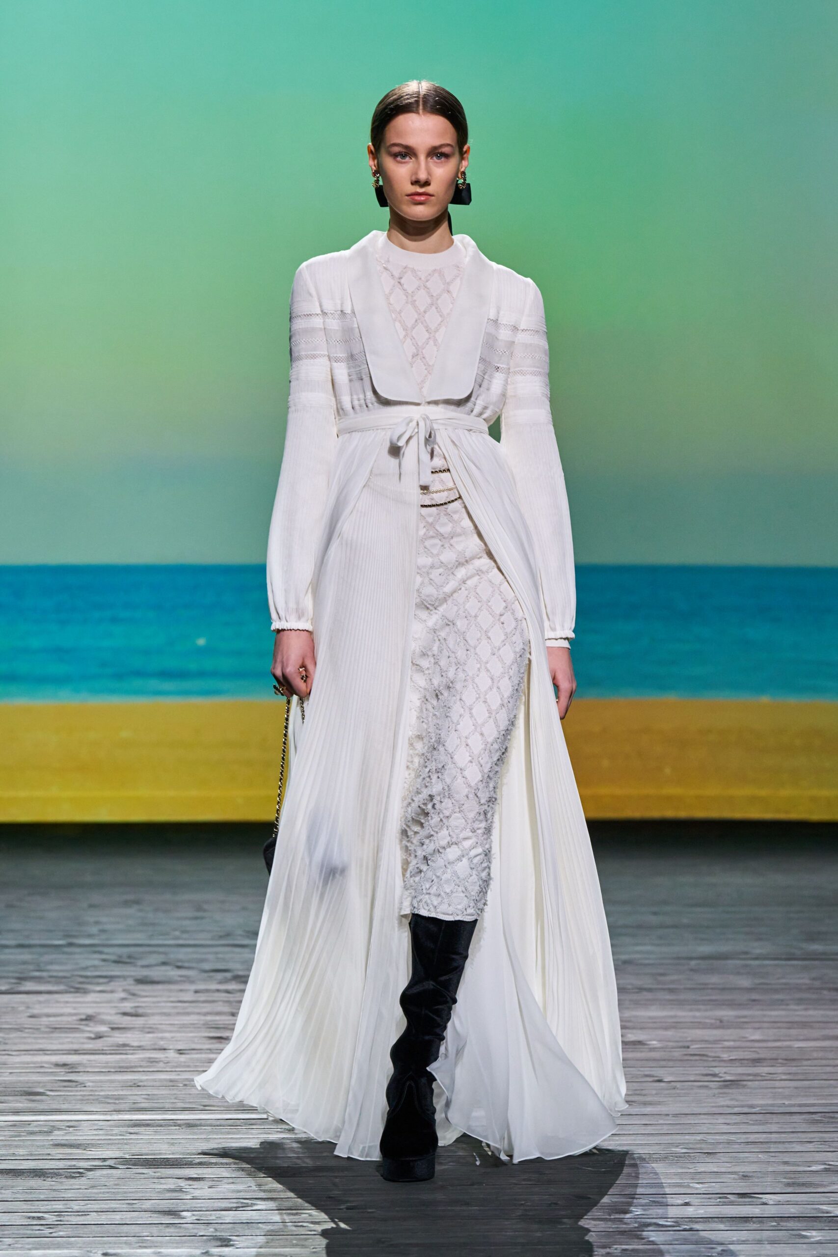 white silk pleated gown with black boots