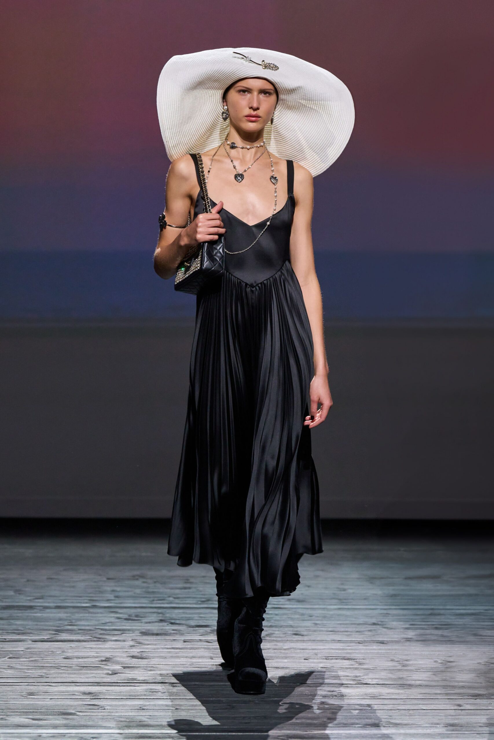 black silk pleated midi dress with white hat