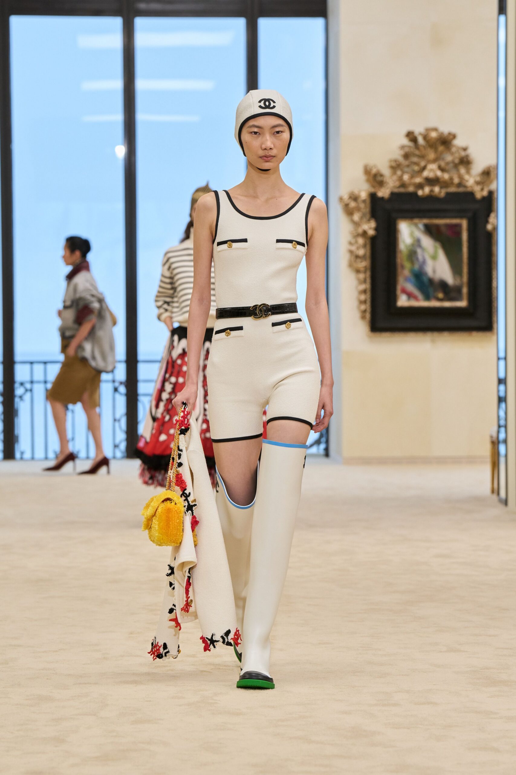 white bodysuit and shorts with boots