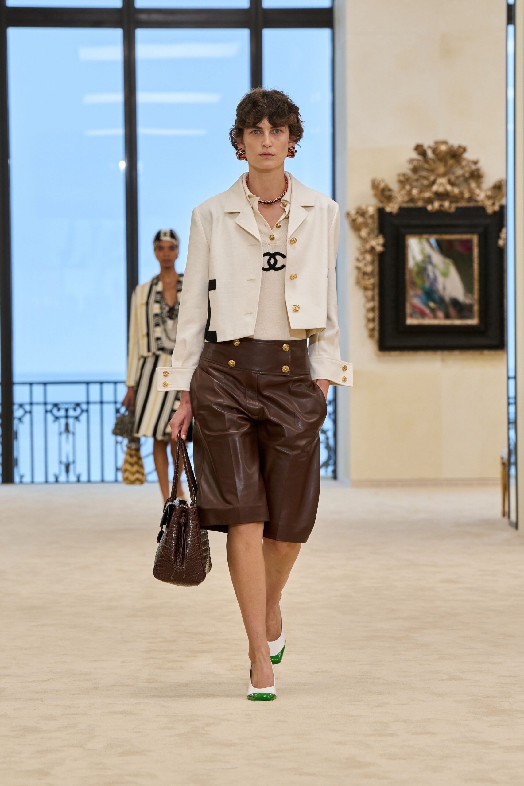 white fitted jacket with brown pants