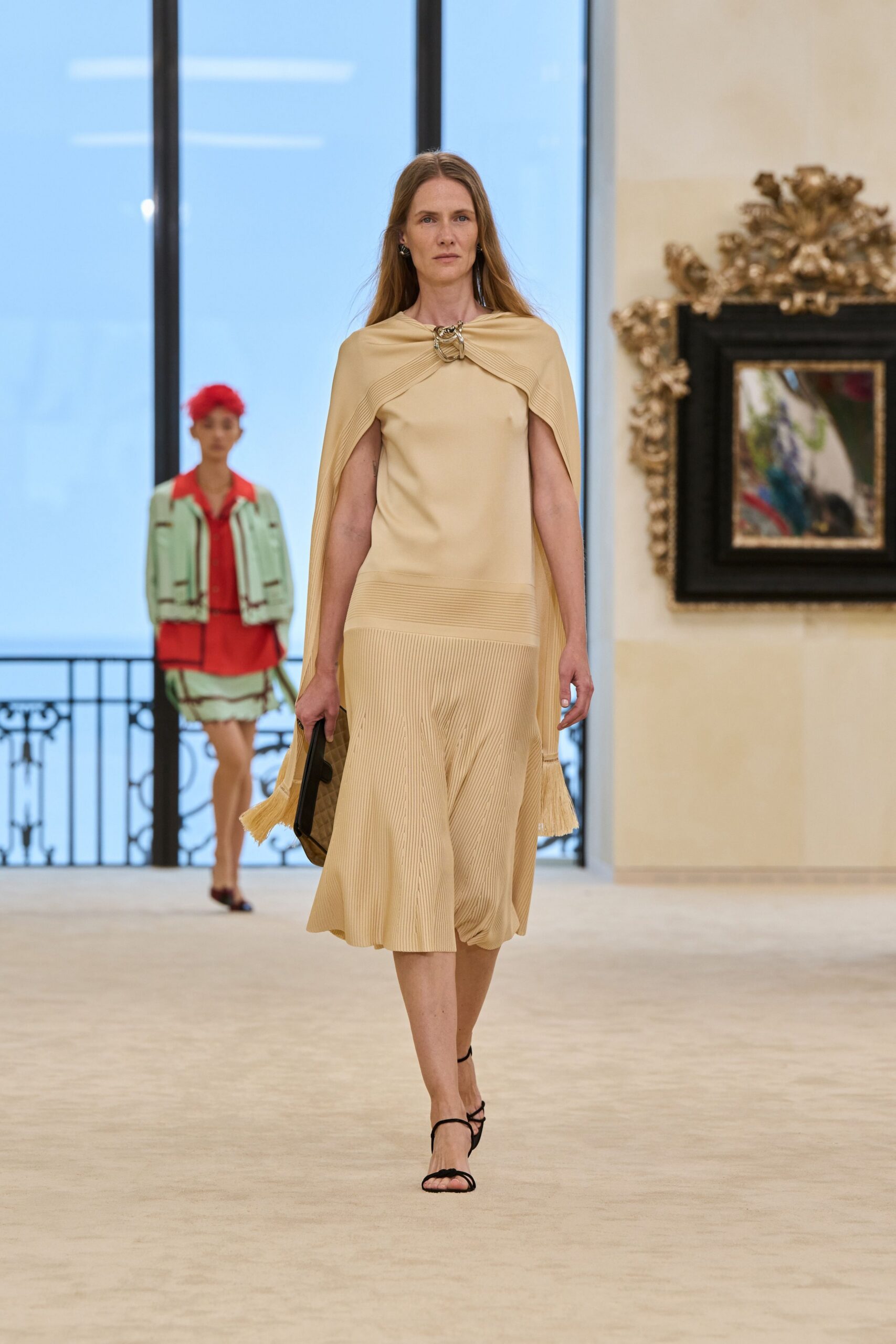 beige silk sleeveless v-neck fitted pleated flowing dress