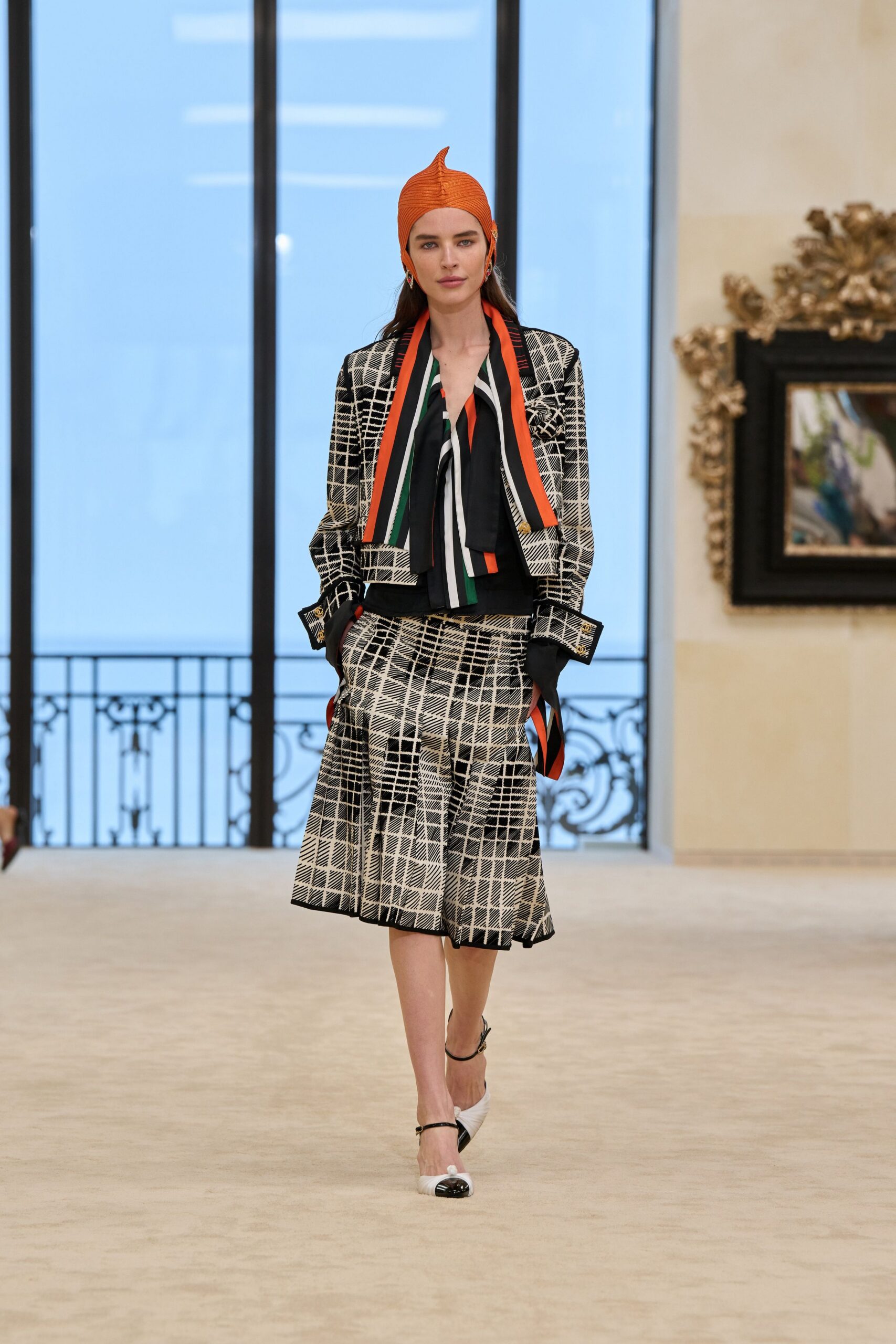 structured jacket with pleated skirt