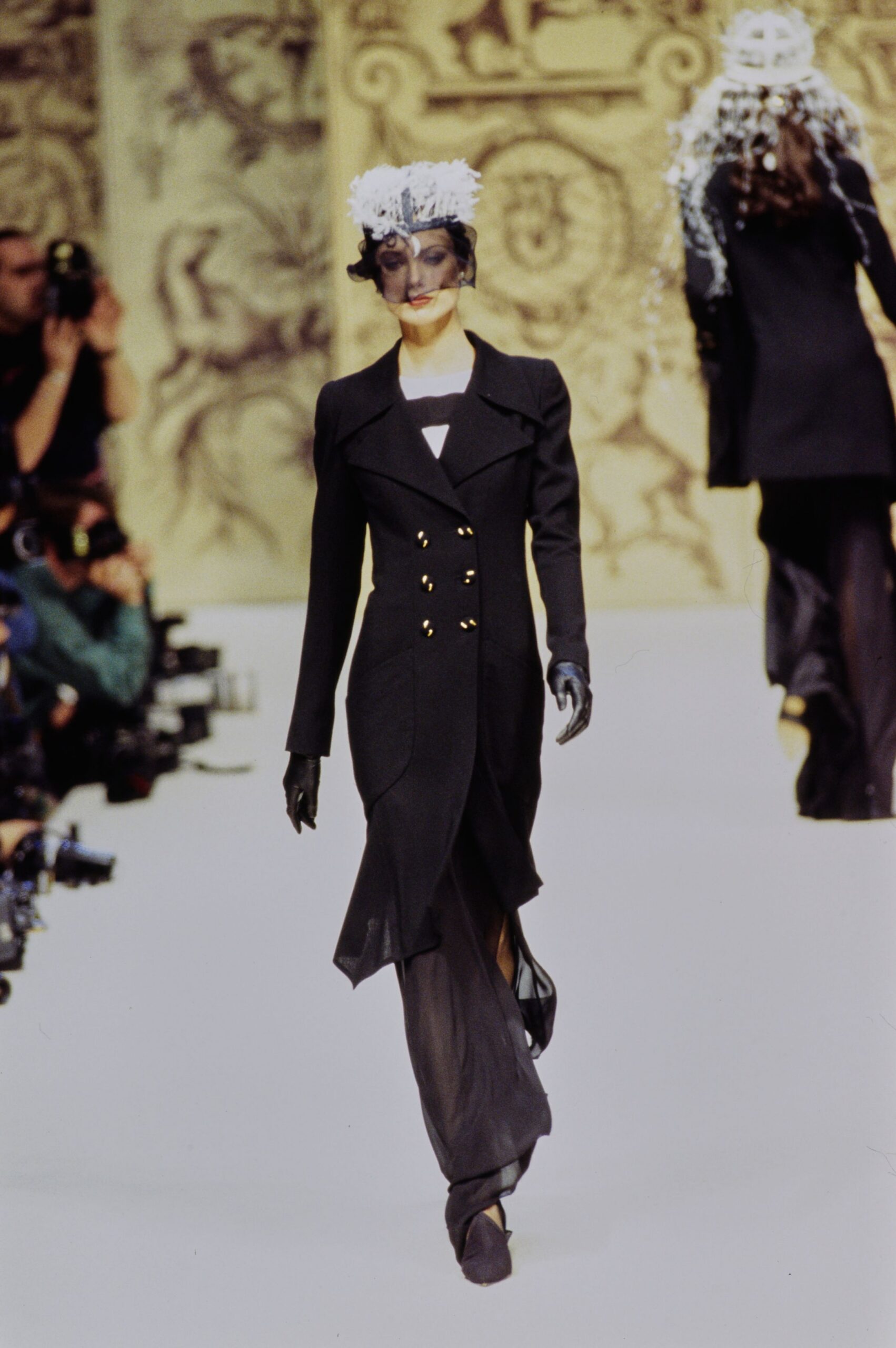 black wool long-sleeve collared fitted buttoned draped coat