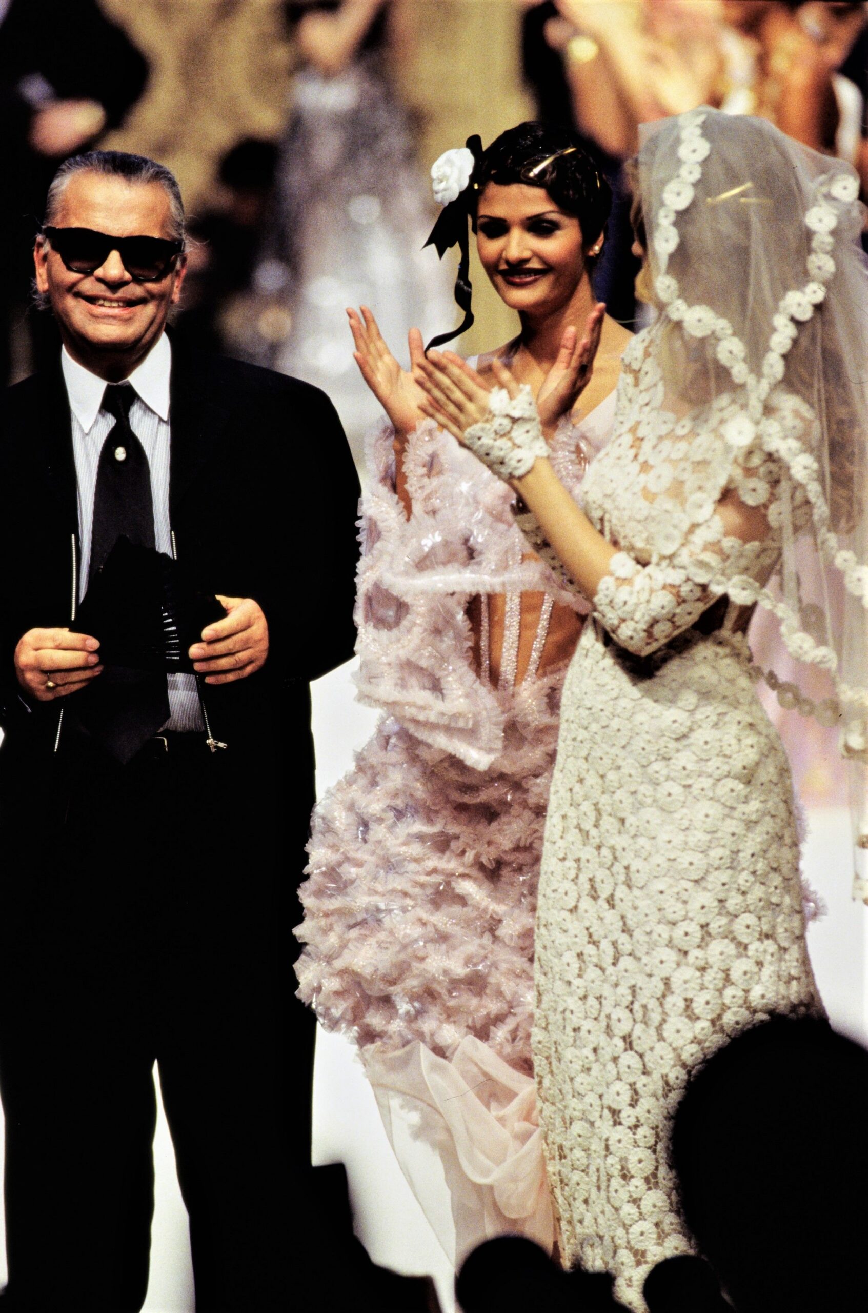 white lace gown and pink ruffled dress