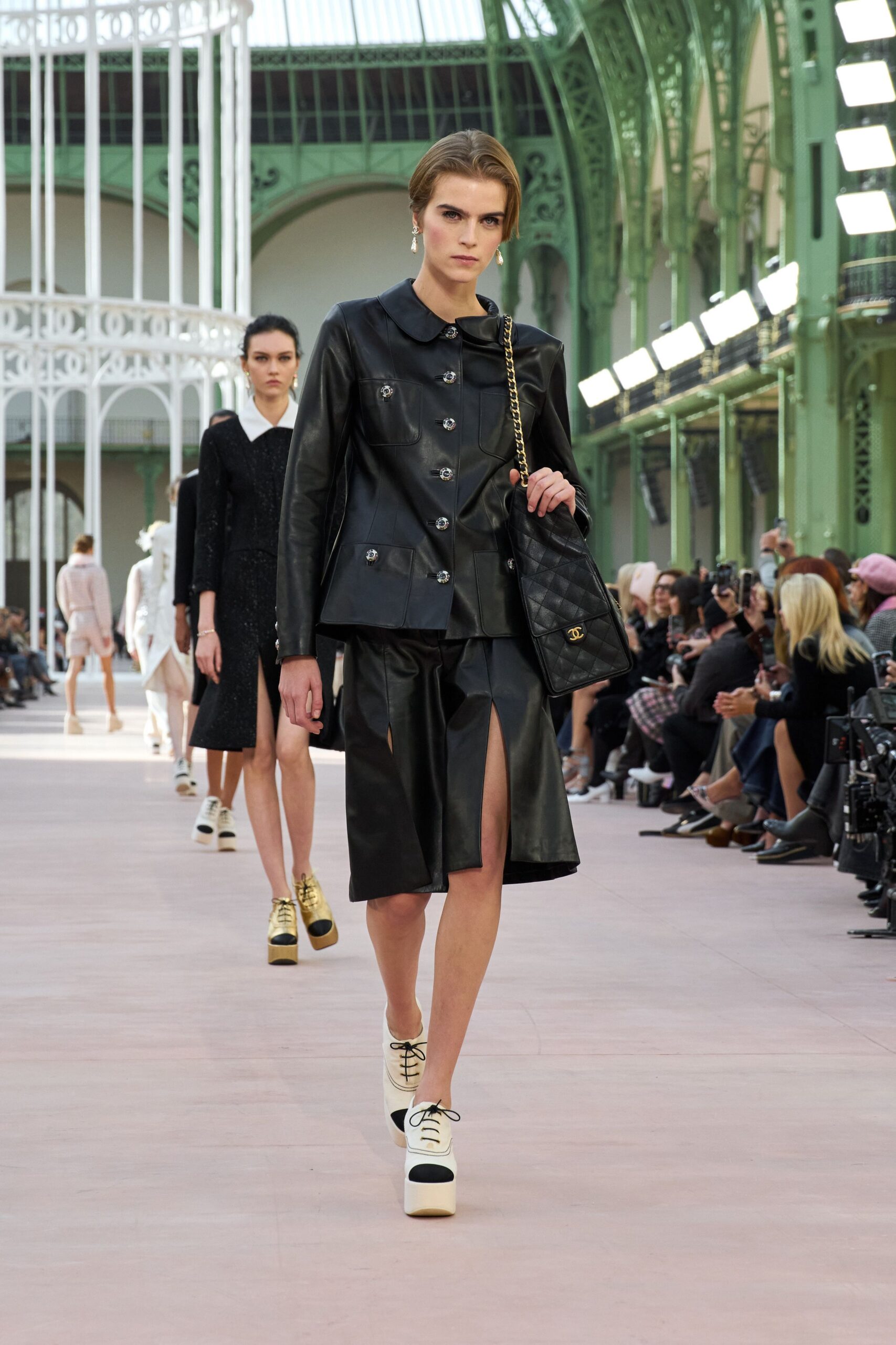 black leather long-sleeve collared fitted buttoned zippered jacket