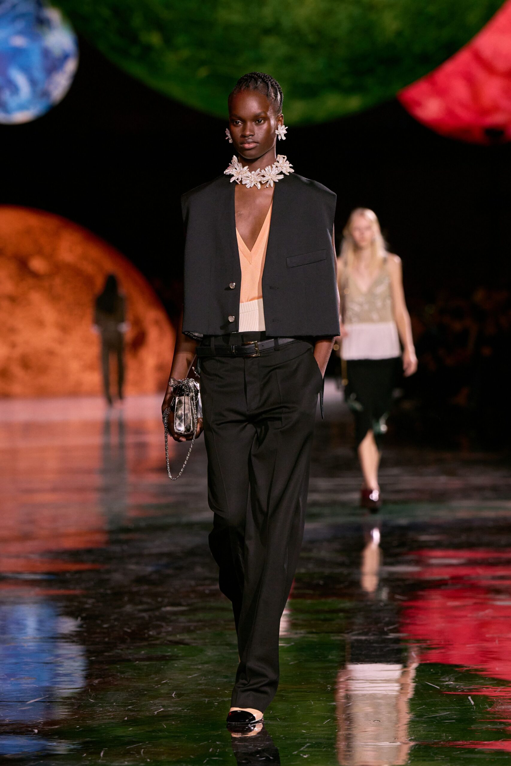 black blazer orange top tailored pants