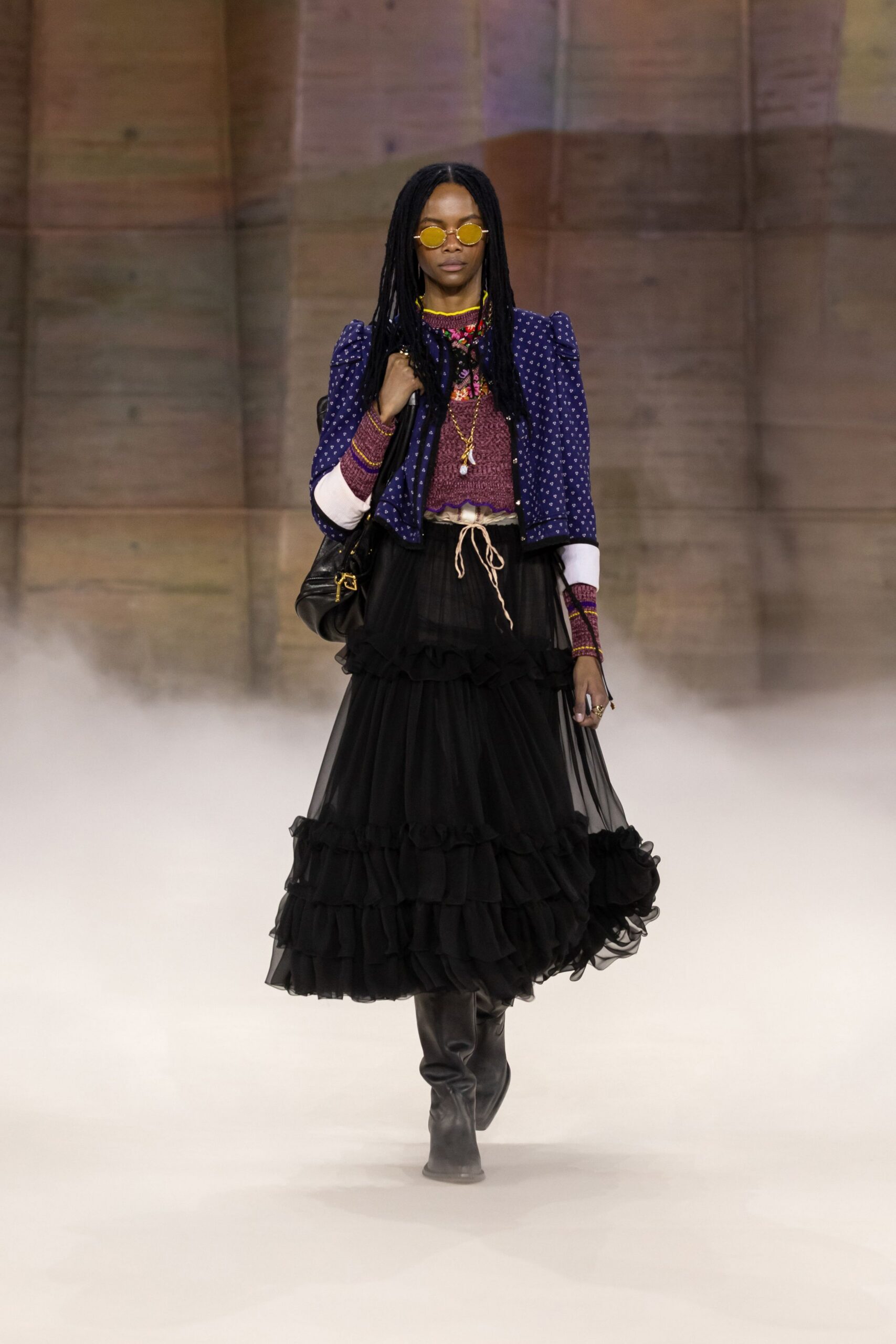 blue polka-dot jacket with black tiered skirt