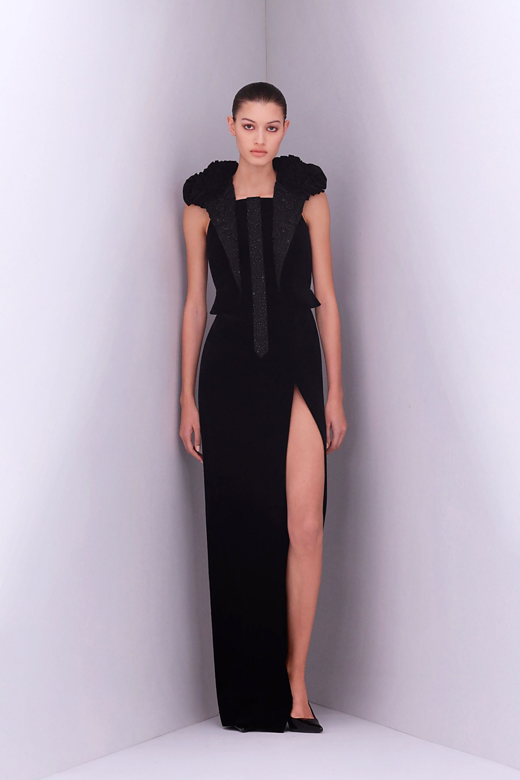 black silk sleeveless v-neck fitted pleated embellished gown