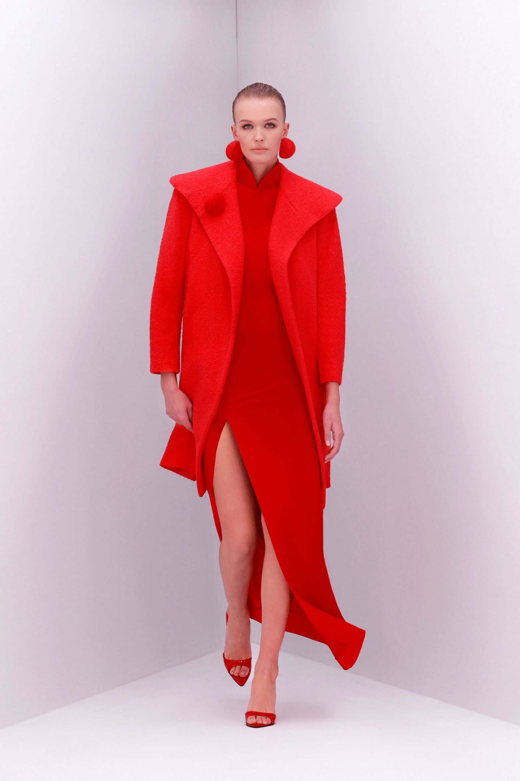 red wool long-sleeve collared oversized structured coat